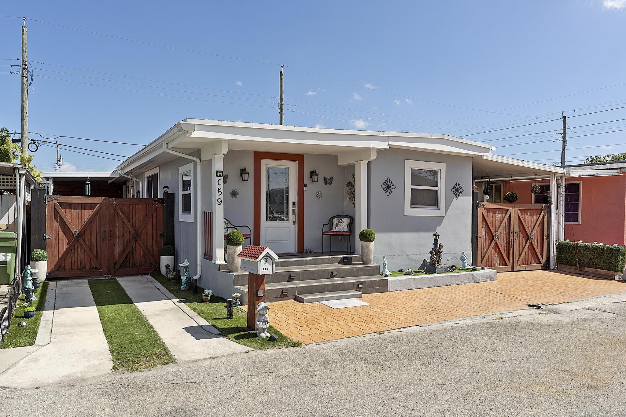 Gorgeous pre-manufactured home with land in the desirable City of Hialeah. This fully remodeled residence features modern finishes throughout, including stainless steel appliances and an in-unit washer and dryer. Can be easily configured as a 3/2, currently set up as a spacious 2/2 with a large laundry room. Enjoy two generous outdoor areas ideal for entertaining, plus a fully equipped exterior kitchen. Property also includes a 12x12 exterior shed for additional storage or workspace. Additional highlights include a newer 5-ton A/C unit, low association fees, low property taxes, and no rental restrictions.