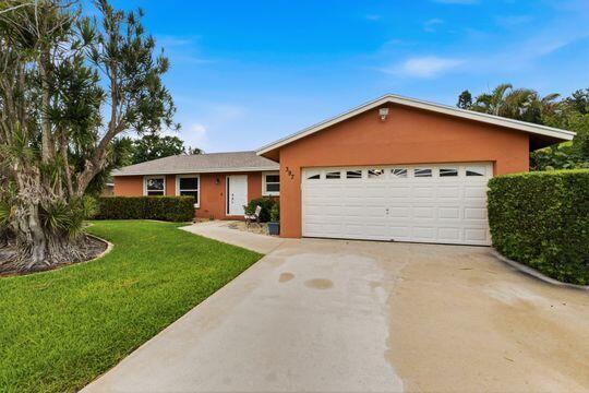 Welcome to this charming single-story residence  offering 4 bedrooms, 3 baths &  2 car garage. This home provides a new roof, impact windows (except for 3 windows),  screened pool (redone 2026), brand new refrigerator, open living space, large kitchen with island, bathrooms have new vanities & lighting, split floorplan and French doors leading to a separate guest/in-law/apt) with living room, kitchen, bedroom, bathroom and  separate entrance. Can be used for the family or extra income. This lovely home is in very good condition , on a great lot,  within walking distance of the school  and no HOA.  Don't miss out on this great family home in a lovely and desirable community.
