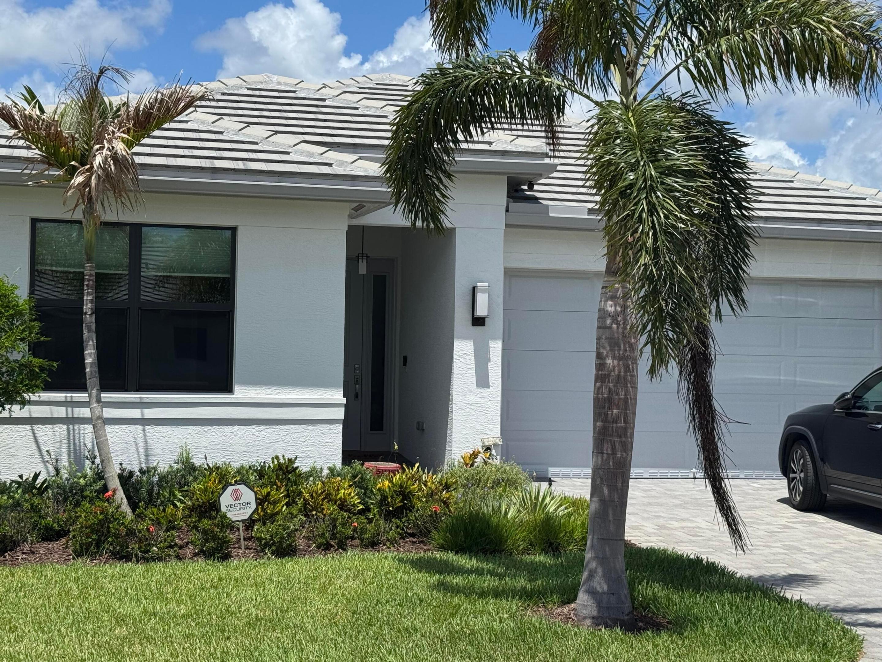 WATERFRONT 2024 home in Valencia Walk at Riverland.  Luxury living in the most popular 55 plus community in southeast Florida for active adults. Nearly new 2024 Sandpiper model in GL homes Valencia Walk development at Riverland in Port Saint Lucie Florida.  Stunning home with open concept floorplan with 1752 sq ft under air. Featuring 2 bedrooms, den/ 3rd bedroom, 2 baths, 2 car garage. Lots of upgrades including high gloss 2 x 2 porcelain tiles throughout the entire house, upgraded kitchen, lighting and fans, and polyaspartic garage floor coating. Custom paint throughout with no pictures ever hung on the walls! Direct waterfront lot with one of the best views and most private settings in the development. Furniture available. 2024 Evolution golf cart negotiable.   Riverland offers amenities second to none. Resort lifestyle with spectacular clubhouse, grand social hall, restaurant, card rooms, billiards room, pool, hot tub, and more all just within Valencia Walk. Included Riverland common facilities minutes away on a scenic golf cart ride down the interconnecting paseo include 24 acre state-of-the-art sportsplex and fitness center with 15 tennis courts, 53 pickleball courts, bocci, Olympic swimming pools, gym, and more.