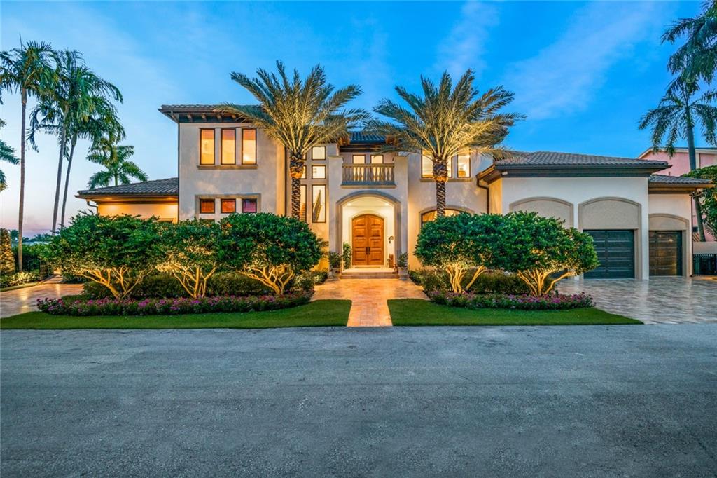 Magnificent water views sweep to the New River and Intracoastal from this impressive Modern Mediterranean estate fronting 125± ft. on the grand Lido Canal, one lot from the point, with prime dockage for a 100±-ft. yacht and a 13,750 square foot lot. Boasting 5 bedrooms, 7 baths and over 7000 square feet of living space, a fabulous entertaining space, opening to the waterfront’s sprawling pool terrace with exquisite landscaping, the spectacular 2-story window-walled great room features a fireside sitting area, media area and professional-style bar. Gourmet kitchen. Paneled office/billiard room. Ultra-luxurious first-floor master suite. 3 car air conditioned garage. Full house generator.