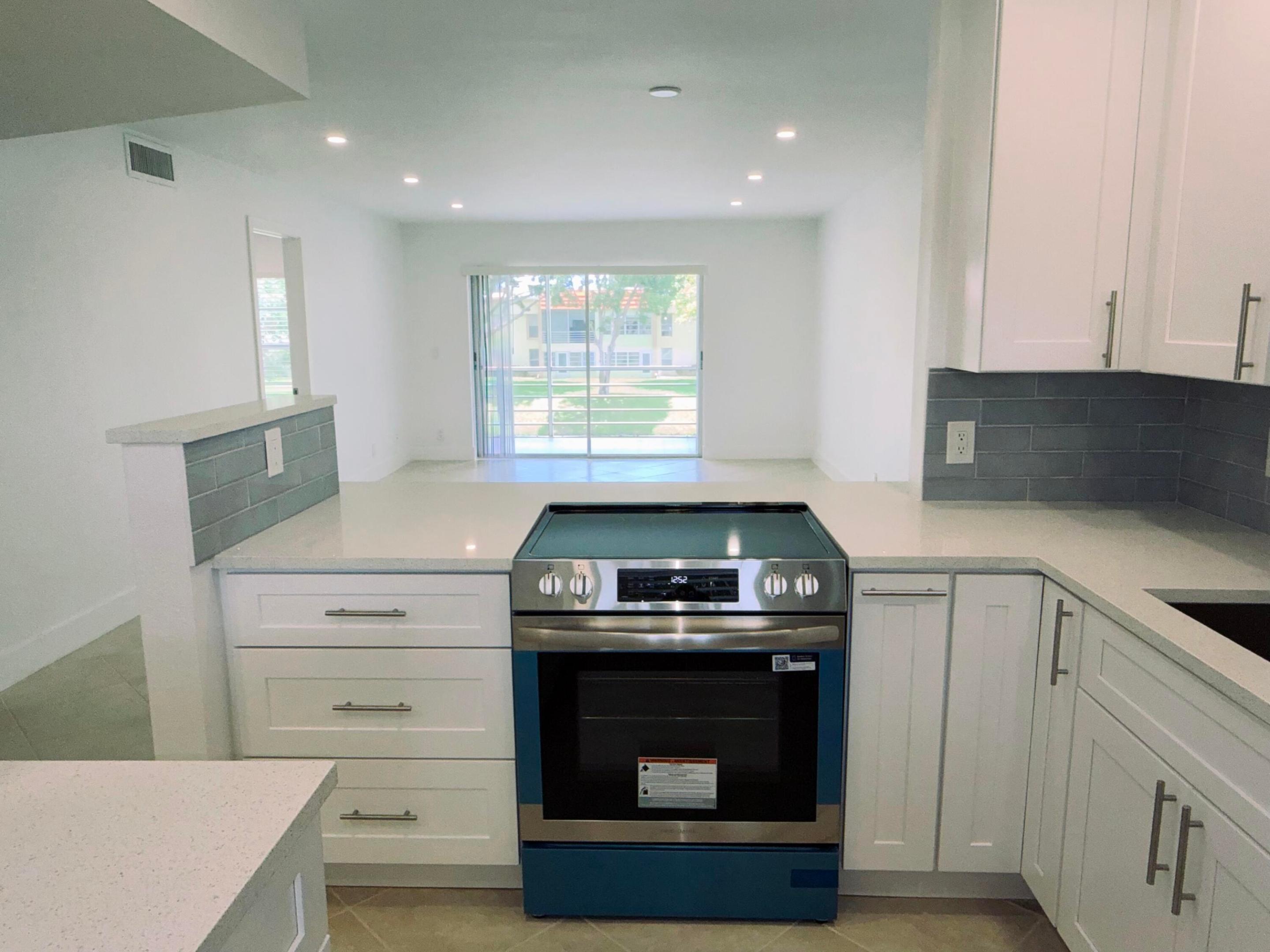 Welcome to this BRAND NEW 2 bedroom 2 bath condo. Completely redone from top to bottom. Beautiful open kitchen, with BRAND NEW TOP of the line APPLIANCES, ample cabinet 's with built in custom BAR AREA. Spacious primary bedroom with a lot of natural light, BRAND NEW vanity, shower, high hat lighting complete with a walk in closet,  Large open living room, dining area great when entertaining.  Lago Delray is a excellent location, just minutes to I-95, Tri rail, Downtown Delray with PRIME SHOPPING, DINING AND ENTERTAINMENT. This AWESOME COMMUNITY has a Pool, Fitness, clubhouse, pickle ball and reserved parking for your convenience.  This beautiful condo is just perfect, must see in person!! In the heart of Delray Beach.