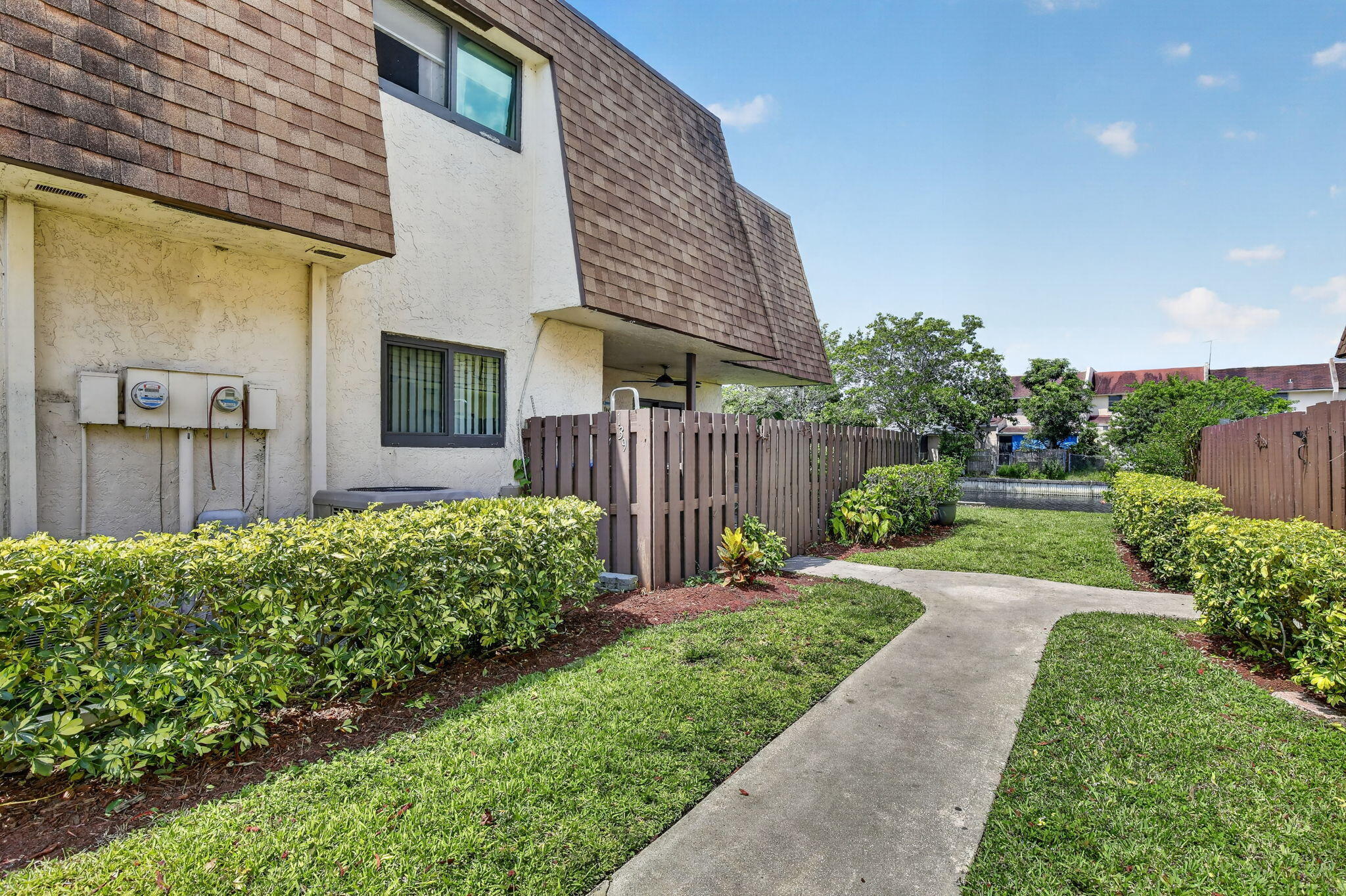 Updated, spacious, and move-in ready 3-bedroom, 2.5-bath townhome in North Lauderdale with beautiful lake views and low HOA dues of only $145 per month. This home features a welcoming courtyard entry, laminate wood flooring throughout, stainless steel appliances, granite countertops, plenty of cabinet space, and a functional layout that works well for everyday living and entertaining. Enjoy the peace of mind of a newer roof from 2020 and a home that needs nothing but a new owner. Perfect for first-time buyers, growing families, or anyone looking for space, comfort, and value. Centrally located near shopping, restaurants, major roads, and the airport. A great opportunity to own a well-maintained townhome in a convenient location