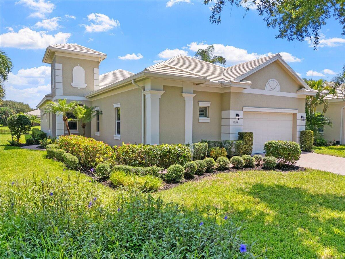 Welcome to this exceptional Riverwind residence, offering 2,722 square feet of beautifully designed living space in the heart of Vero Beach. This spacious home features three generously sized bedrooms, three and a half bathrooms, and soaring vaulted ceilings that create an open, light-filled atmosphere. The thoughtfully designed floor plan flows effortlessly, providing both comfort and functionality for everyday living and entertaining Enjoy peaceful pond views from the main living areas and the covered back patio, creating a private, tranquil setting to relax and unwind. A two-car garage provides ample space for parking and additional storage. Nestled within the desirable Riverwind community, residents enjoy a welcoming neighborhood, clubhouse amenities, and a prime location just minutes  Vero Beach's shopping, dining, golf, and beautiful beaches. This is coastal Florida living at its finest.