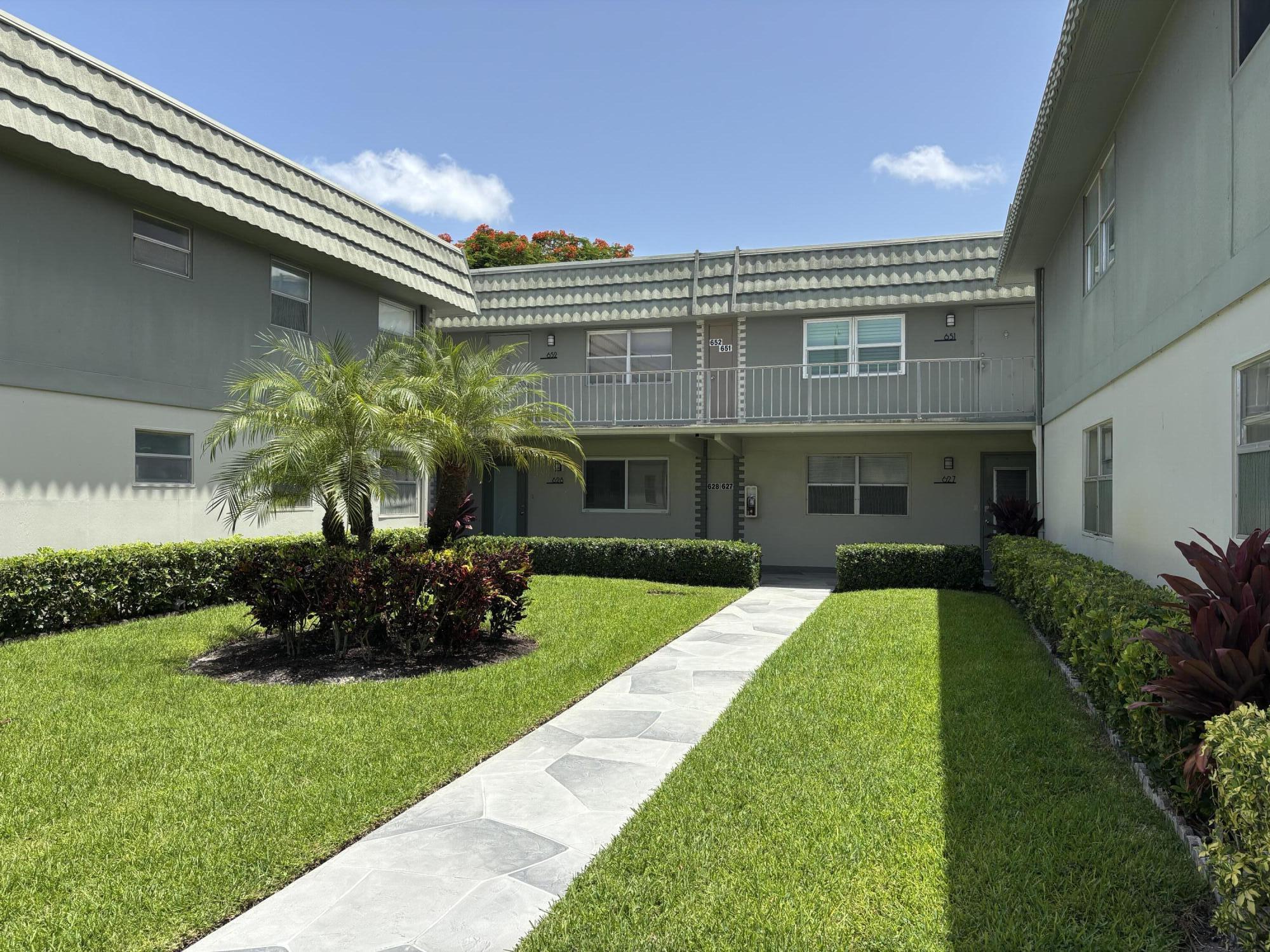 Welcome home to this tastefully remodeled second floor, two bedroom two bath condo offering peaceful garden views in the 55 plus community of Kings Point. The bright living space offers a serene fireplace accent piece perfect for relaxing. The home includes a screened in balcony with a washer and dryer and the peace of mind of a 2023 A/C. Move-in ready in one of Delray's most desirable active-adult communities featuring world-class amenities including golf, multiple pools, tennis, pickleball, fitness centers, cafés, clubs, theaters, and courtesy shuttles.