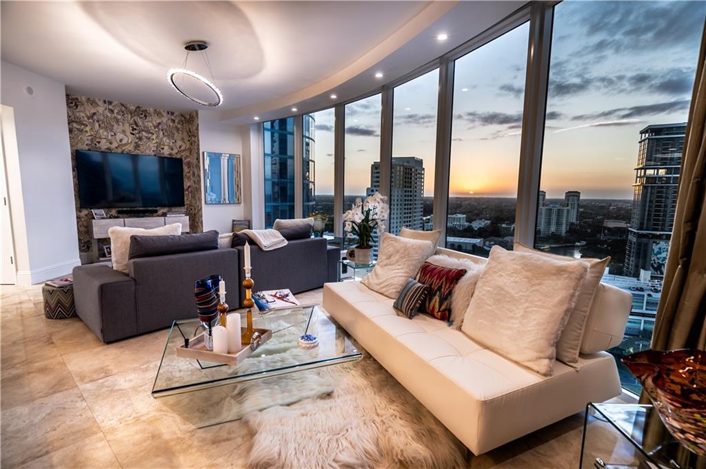 Priemer Luxury building, best location on Las Olas. Stunning 07 line,  with magnificent views of the gorgeous river and magical sunsets. There is absolutely nothing that needs to be upgraded. Gorgeous kitchen cabinets with Cristallo counter tops and gorgeous Missoni wall paper. Polished Marble floors that run throughout the unit. Beautiful master bath that feels like a spa. Huge balcony off the kitchen with plenty of room for dinning and lounging with metropolitan view. Floor to ceiling views that captures the most brilliant light the envelopes this master piece. Luxury shopping, dining, grocery and nightlife steps out of your building. Not to mention the gorgeous beaches of Fort Lauderdale. This is truly a special home that will not be available long.