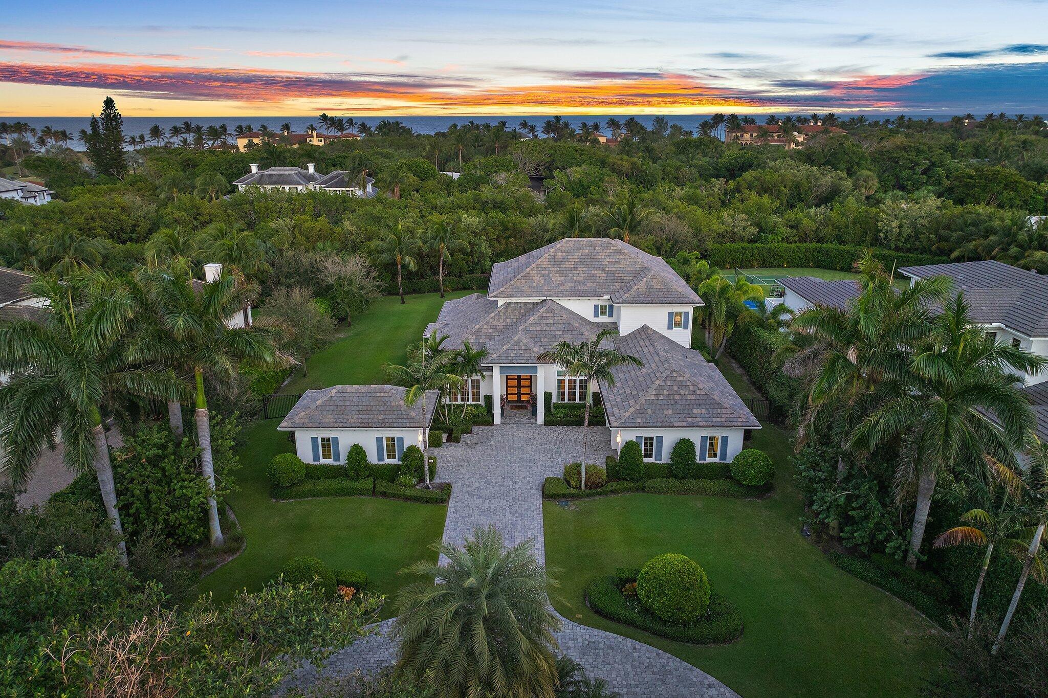 This is the one!  Being offered fully furnished, this stunning property in a premier private location, on an acre of property with designer finishes, is priced to sell.  A spectacular home that offers the pinnacle of Florida living with every modern amenity.  Built in 2016 and offering 6,550 total square feet, five bedrooms, five full and one-half baths. Sun lit rooms flow easily to a tropical outdoor paradise complete with summer kitchen with a covered dining area.  An oversized pool and jacuzzi with sun shelf accommodate all types of fun in the sun and are located just steps to the large fire pit.  Manicured grounds and expansive entertaining space accommodate every possible option from family barbeque to a cocktail party for 50. Natural Light and designer finishes welcome you as you enter this beautiful space.  Featuring an open floor plan that enhances views of the pool and manicured grounds.  Moving through the large great room, kitchen and breakfast area, you are surrounded by contemporary elegance that is second to none. A formal dining room with adjacent bar and wine closet are just some of the features this special home offers.
Complete with five bedrooms, five and ½ baths as well as a spacious office, there is room for family and friends alike.  Located on the first-floor the primary bedroom overlooks sumptuous gardens and the sparkling pool.  Featuring a large walk-in closet and spa like bath. His and Her vanity's, soaking tub and oversized shower offer the perfect place to unwind and refresh. A second bedroom with en-suite bath located on the first floor provides options that will accommodate every family need.  Three additional en-suite bedrooms located on the second level round out the bedroom space.
Also located on the second level is an impressive 28' by 24' Club Room.  Equipped with a large wet bar with refrigerator drawer, early morning coffee or a nightcap is a breeze for your guests or family members.  This space is perfect for game night, sleep overs for the kids or a secluded place to read a book while enjoying a cool ocean breeze on the covered balcony.
Technology is the hallmark of this home. A Control4 platform is the operating system for the entire home. Managing the entertainment system, air conditioning, garage doors all from your mobile device offers security and peace of mind. In addition to full impact rated windows and doors, Armor Screens provide hurricane protection for the lanai and summer kitchen as an additional layer of security. A 22 KW Generator and 1,000-gallon buried propane tank are also on site. Garage space for 3 vehicles complete the picture.