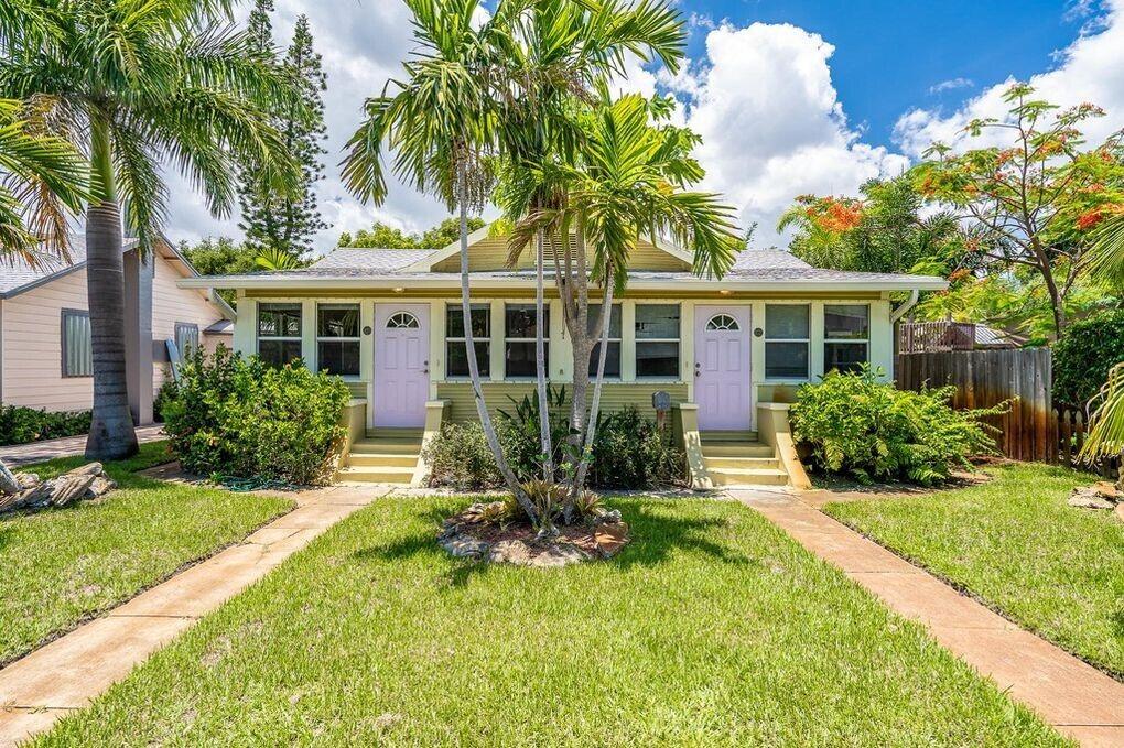 Cozy Lake Worth Duplex with Porch, Yard & Prime Location.  Live just blocks from the beach and downtown in this charming Lake Worth Duplex that blends character with convenience. This 2-bedroom, 1-bath home features wood-look floors, high ceilings, and large windows that fill the space with natural light. A spacious living area connects to a separate dining room, and the oversized front porch offers a breezy spot to enjoy morning coffee or evening cocktails.  The fully fenced backyard is perfect for pets, gardening, or weekend hangouts, and the location can't be beat, just minutes to the Intracoastal, Bryant Park, and vibrant downtown shops and restaurants. Quick access to I-95 makes commuting a breeze, while the laid-back neighborhood offers true South Florida charm. Newly Remodeled 2 Bed 2 Bath Duplex: Updated Duplex In Lake Worth. Featuring Hardwood floors in living room and bedrooms, and tile throughout the rest of the home, No Carpet! Tons of natural light, Stainless steel appliances and granite countertops! Brand New AC! Washer/ Dryer are located in the studio in the beautiful Fenced in backyard with lots of flowers and fruit trees. ROOF IS 2004