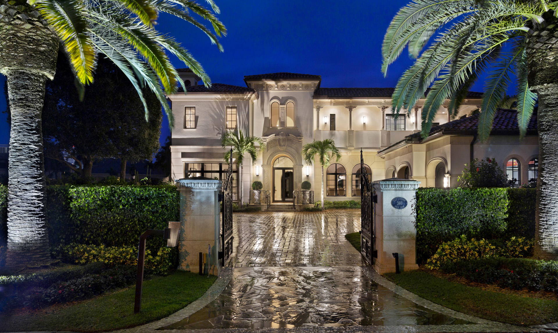 Reimagined with a fresh, light transitional flair, this gated Palm Beach-inspired estate fronts 111± feet on the Buccaneer Palm Waterway equipped with full-service yacht dockage.  The grand entertainment loggia is a true outdoor living room with a pecky cypress ceiling, romantic gas fireplace, and high-end summer kitchen.  Lounge areas on the marble terrace surround the glistening infinity pool with spa.  A putting green and an outdoor shower are also provided on the spacious, deep grounds served by an expansive motor court allowing ample guest parking.

Royal Palm Yacht and Country Club membership is separate and not affiliated with RPIA homeownership. DISCLAIMER: The written and verbal information provided including but not limited to prices, measurements, square footages, lot sizes, calculations and statistics have been obtained and conveyed from third parties such as the applicable Multiple Listing Service, public records as well as other sources. All information including that produced by the Sellers or Listing Company are subject to errors, omissions or changes without notice and should be independently verified by any prospect for the purchase of a Property.  The Sellers and Listing Company expressly disclaim any warranty or representation regarding all information.  Prospective purchasers' use of this or any written and verbal information is acknowledgement of this disclaimer and that Prospects shall perform their own due diligence.  Prospective purchasers shall not rely on any written or verbal information provided when entering a contract for sale and purchase.  Some affiliations may not be applicable to certain geographic areas. If your property is currently listed, please do not consider this a solicitation. In the event a Buyer defaults, no commission will be paid to either Broker on the Deposits retained by the Seller.  "No Commissions Paid until Title Passes."  Copyright 2018 Listing Company. All Rights Reserved.
Royal Palm Yacht and Country Club membership is separate and not affiliated with RPIA homeownership.