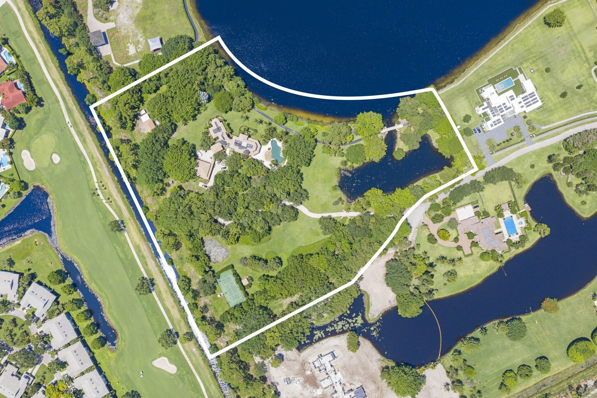 First Time Available Ever. Lot One. The only 10++ Acre trophy compound in the ultra exclusive gated Boca Raton enclave, Le Lac.  This sprawling cul-de-sac estate was designed by Affiniti Architects and Interior Designer Michael Wolk. The home is constructed with poured concrete. Its exceptional floor plan and flexible layout features: Private Gated Entry, Grand Staircase, 7 Bedrooms, 7 full and 2 half bathrooms, Media room, Gym, Office, Garage parking for 16 cars, Convertible guest house, Resort style beach entry walk-in lap pool with waterfall, Hot tub and infinity edge, Tropical landscaping, Specimen plants and fruit trees, Private bridge, Private lake with dock, 1 golf green and 2 tees for a par 3 and par 4, Tennis/basketball court, Open fields, Breathtaking lake views  Le Lac is a 200 acre exclusive guard gated community with a walking path and three lakes that allow for boating and water sports. 1.5% of sale price paid to Le Lac HOA by buyer at closing. Minutes from Boca Raton's private airport, international airports, beaches, beach clubs, golf clubs, universities and private schools, shopping and fine dining. *Photos & Floor Plans Coming Soon*
