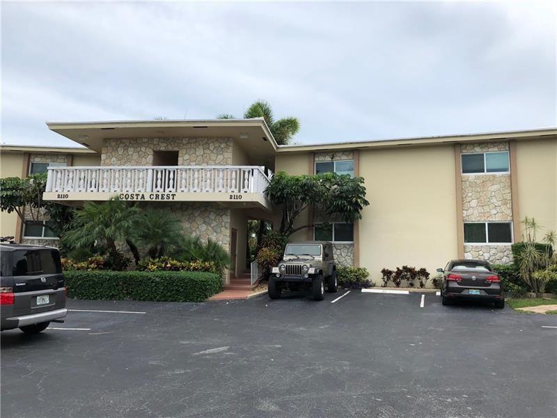 Condo is being sold AS-IS. OK TO LEASE THE FIRST YEAR. Tenant occupied with long term lease. First floor unit with high impact windows and doors. New AC & Hot Water heater, bathroom remodeled, laminate flooring, semi-open kitchen. Costa Crest is a cozy, boutique building in the Coral Ridge area of only 20 condos. Walk to Fresh Market, LA Fitness, restaurants, shops, bus route, easy highway access.  The beach is very close, short bike ride via Oakland Park or Commercial Blvd.