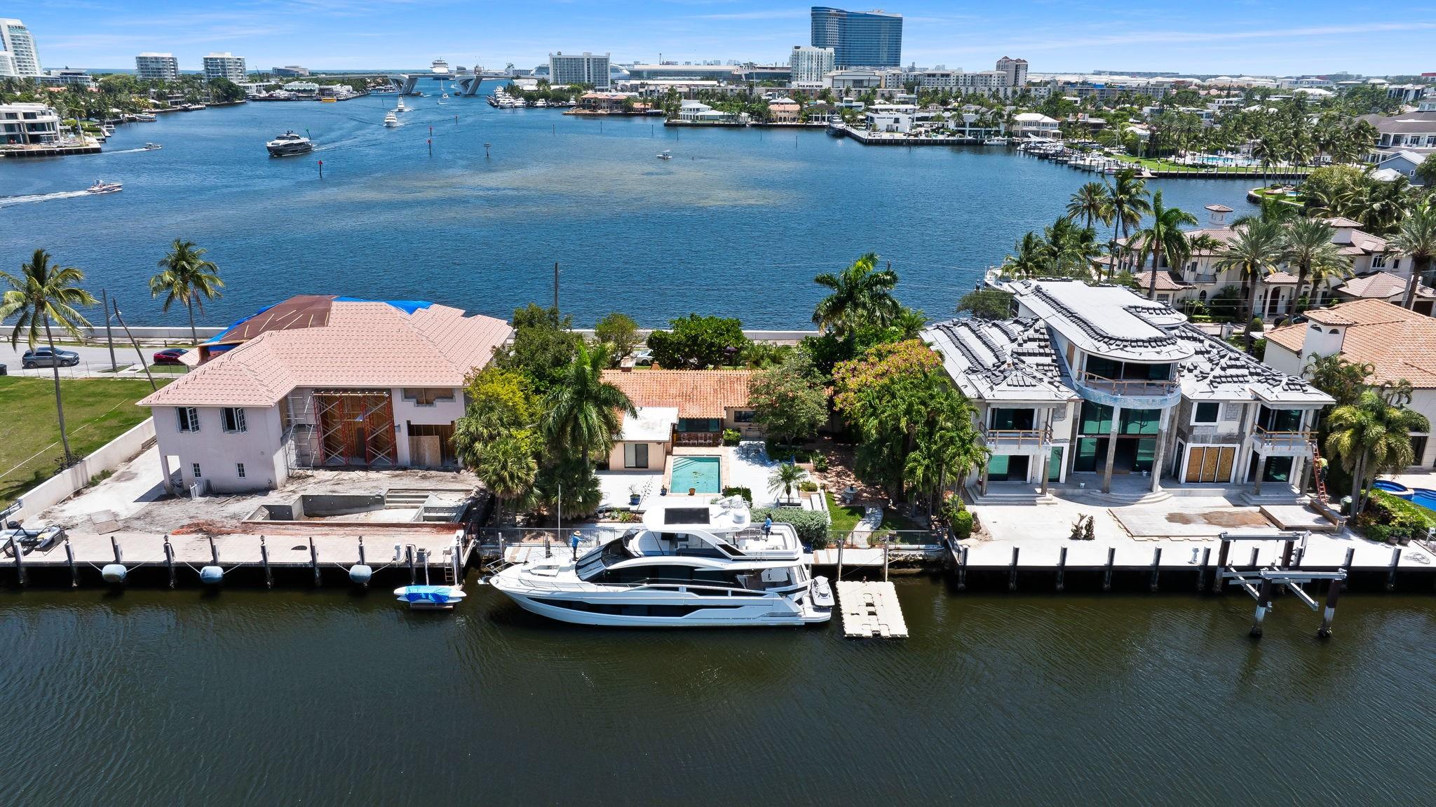 Rarely available lot in prestigious Rio Vista neighborhood, this 12,500 SF redevelopment lot offers a once-in-a-lifetime opportunity to build your dream estate with breathtaking dual water views. Enjoy 100 feet of waterfront frontage—perfect for docking your yacht—on a deep, wide canal with no fixed bridges and easy ocean access. From the front of the property, take in the expansive southeastern views toward the 17th Street Causeway Bridge and the Lauderdale Yacht Club, setting a dramatic scene day or night. From the rear, enjoy the serene backdrop of canal-front living with privacy and luxury. Situated in one of Fort Lauderdale’s most sought-after neighborhoods.
