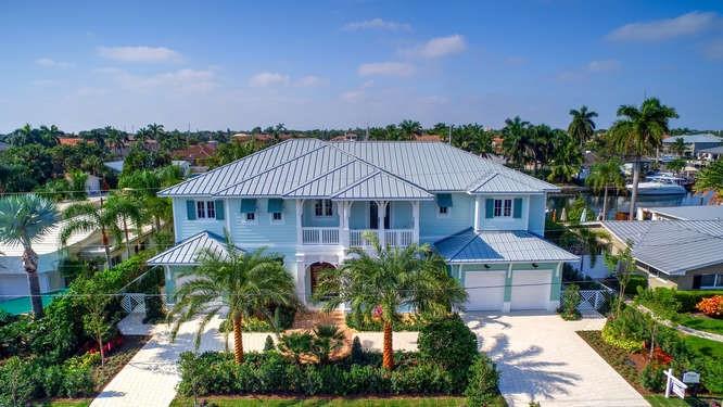 Luxury coastal home located in the coveted Lake Placid area of Lighthouse Point. This 5 bed, 6 bath estate is finished with the finest quality & craftsmanship featuring heavy white millwork, wood paneling, polished nickel fixtures, custom cabinetry and intricate tile & wood designs. Lovely outdoor living area with covered patios and summer kitchen. Two laundry rooms and closet systems. All living spaces are palatial & the bedrooms are generous. Long wide water views are evidenced throughout the home.