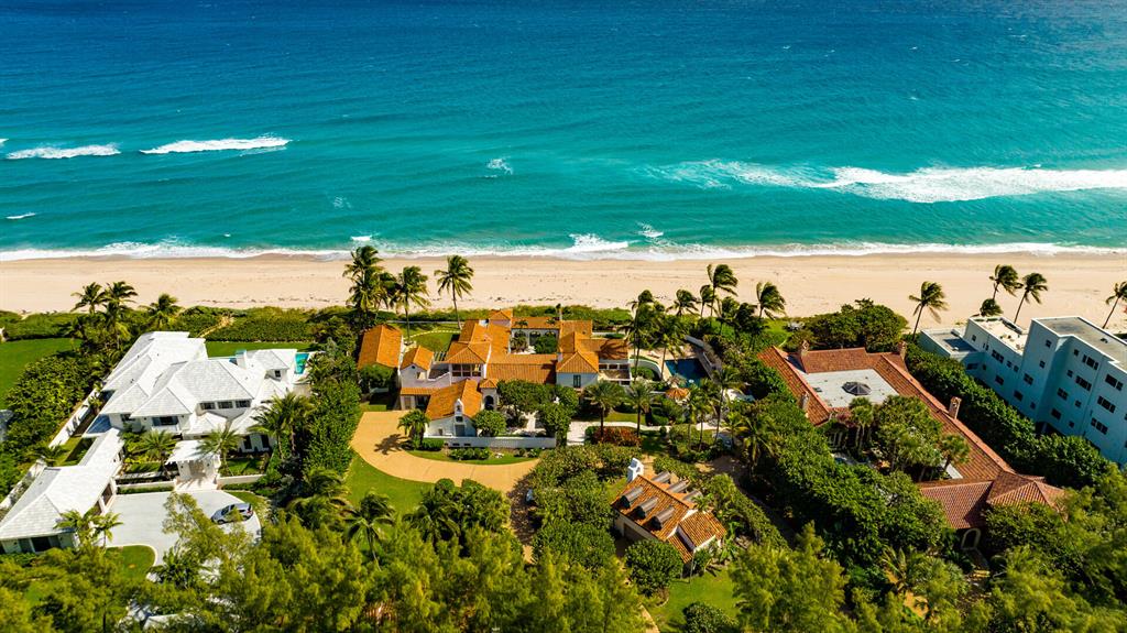 On lushly landscaped 1.32 +/- acres with 200 feet of oceanfront, this historic compound recalls the elegance of the 1920s. Wander through romantic courtyards and lush gardens, take in the beauty of the ocean, and enjoy this estate's curated embellishments. This luxury compound includes the main residence, a separate gate house, detached garage with a studio apartment, gym, and cabanas by the pool.
The information herein is deemed reliable and subject to errors, omissions or changes without notice.  The information has been derived from architectural plans or county records. Buyer should verify all measurements This rare historic 1926-era compound, with 200 feet of oceanfront, inviting courtyards and lush gardens, is totally modernized  for luxury living and embellished with curated finishes from around the world. 

LOCATION: 

In the prestigious town of Gulf Stream, a hidden gem in the heart of South Florida's Gold Coast just north of Delray Beach, this historic direct oceanfront mansion was designed by society architect Howard Brougham Major for Wall Street banker and onetime president of the United States Golf Association, Howard Whitney. Dating from 1926, it is from the same era as the  famous Addison Mizner-designed Gulf Stream Golf Club and Gulf Stream Polo Club -- both of which established this then-new community as an exclusive winter luxury resort. 

PROPERTY:

Presiding over more than 200 feet of oceanfront, this gated and walled compound, which recalls the elegance and glamour of 1920s Palm Beach, invites gracious entertaining and the enjoyment of luxurious leisure time by the sea. Creating a grand sense of arrival, the drive meanders through lushly landscaped 1.32 +/- acres to the mansion's main courtyard, past outbuildings that include the charming three-bedroom gatehouse, a garden house with a two-car garage and studio apartment, and the gym. In the romantic courtyard garden that surrounds the 20-by-40-foot saltwater pool and cabanas, a noteworthy embellishment includes Spanish tiled murals custom-created by artist Jose Manuel Tos. 

RESIDENCE: 

Masterfully conceived by renowned society architect, Howard Major, this iconic 1926-era landmark masterpiece, "Viento y Mar," features exquisite details in keeping with its era coupled with curated European-sourced ornamentations plus every accommodation for modern luxury living. Details of this magnificent 12,627 +/- total-square-foot estate include tranquil ocean views from all the main rooms, 19th-century ironwork, cypress-lined cathedral ceilings, and a medley of handsome flooring that include antique reclaimed limestone and sandstone, hardwood, and antique French blanc-rose terracotta tile. With a brilliant layout built around a breezy central courtyard framed by glass-walled galleries, this amazing residence is introduced by way of a romantic front courtyard garden, highlighted by a beautiful fountain imported from France. From here, one enters into an enchanting foyer that immediately offers a long view down the adjoining gallery to the ocean. In the living room, the gas fireplace is adorned by an 18th century mantel from a French Chateau. An outstanding detail in the ocean-view dining room is its antique tile wall mural, which was preserved from a Cuban hacienda. A butler's pantry connects the dining room to the cook-island kitchen, topped by a beadboard-lined ceiling and fitted with custom cabinets, Carrera marble tops, professional-grade appliances, and large walk-in pantry. The primary suite, with French doors that open to the ocean, comprises a large closet and spa-inspired Caesar-stone and marble bathroom. Completing the floor plan of the main residence are three guest bedroom suites, media room, second-floor ocean-view terrace and attached two-car garage. An artful transformation of an historic property for unparalleled luxury living, this breathtaking compound, which endures as one of Gulf Stream's largest and most prestigious estates, now awaits curation by its next discerning owner.

DISCLAIMER: Information published or otherwise provided by the listing company and its representatives including but not limited to prices, measurements, square footages, lot sizes, calculations, statistics, and videos are deemed reliable but are not guaranteed and are subject to errors, omissions or changes without notice. All such information should be independently verified by any prospective purchaser or seller. Parties should perform their own due diligence to verify such information prior to a sale or listing. Listing company expressly disclaims any warranty or representation regarding such information. Prices published are either list price, sold price, and/or last asking price. The listing company participates in the Multiple Listing Service and IDX. The properties published as listed and sold are not necessarily exclusive to listing company and may be listed or have sold with other members of the Multiple Listing Service. Transactions where listing company represented both buyers and sellers are calculated as two sales. The listing company's marketplace is all of the following: Vero Beach, Town of Orchid, Indian River Shores, Town of Palm Beach, West Palm Beach, Manalapan Beach, Point Manalapan, Hypoluxo Island, Ocean Ridge, Gulf Stream, Delray Beach, Highland Beach, Boca Raton, East Deerfield Beach, Hillsboro Beach, Hillsboro Shores, East Pompano Beach, Lighthouse Point, Sea Ranch Lakes and Fort Lauderdale. Cooperating brokers are advised that in the event of a Buyer default, no commission will be paid to a cooperating Broker on the Deposits retained by the Seller. No commissions are paid to any cooperating broker until title passes or upon actual commencement of a lease. Some affiliations may not be applicable to certain geographic areas. If your property is currently listed with another broker, please disregard any solicitation for services. Copyright 2022 listing company All Rights Reserved
