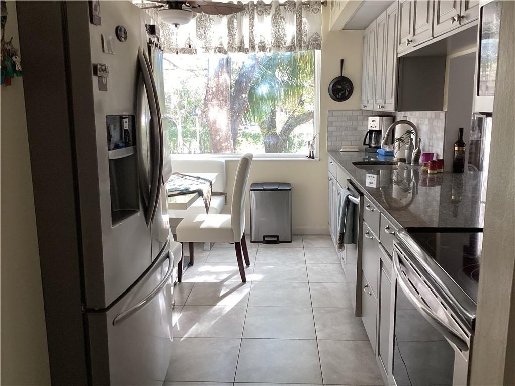 Do not miss this spacious corner Condo with natural light and beautiful view, big updated kitchen with granite counter tops, walk-In tub, full size new washer and dryer, tile floor in the entire unit included the huge screened balcony. HIGH IMPACT WINDOWS. Right across to the full service plaza with supermarket, restaurants and more. Just few blocks away from Broward Mall and main roads. Make your appointment before is too late! Equal Housing Opportunity.