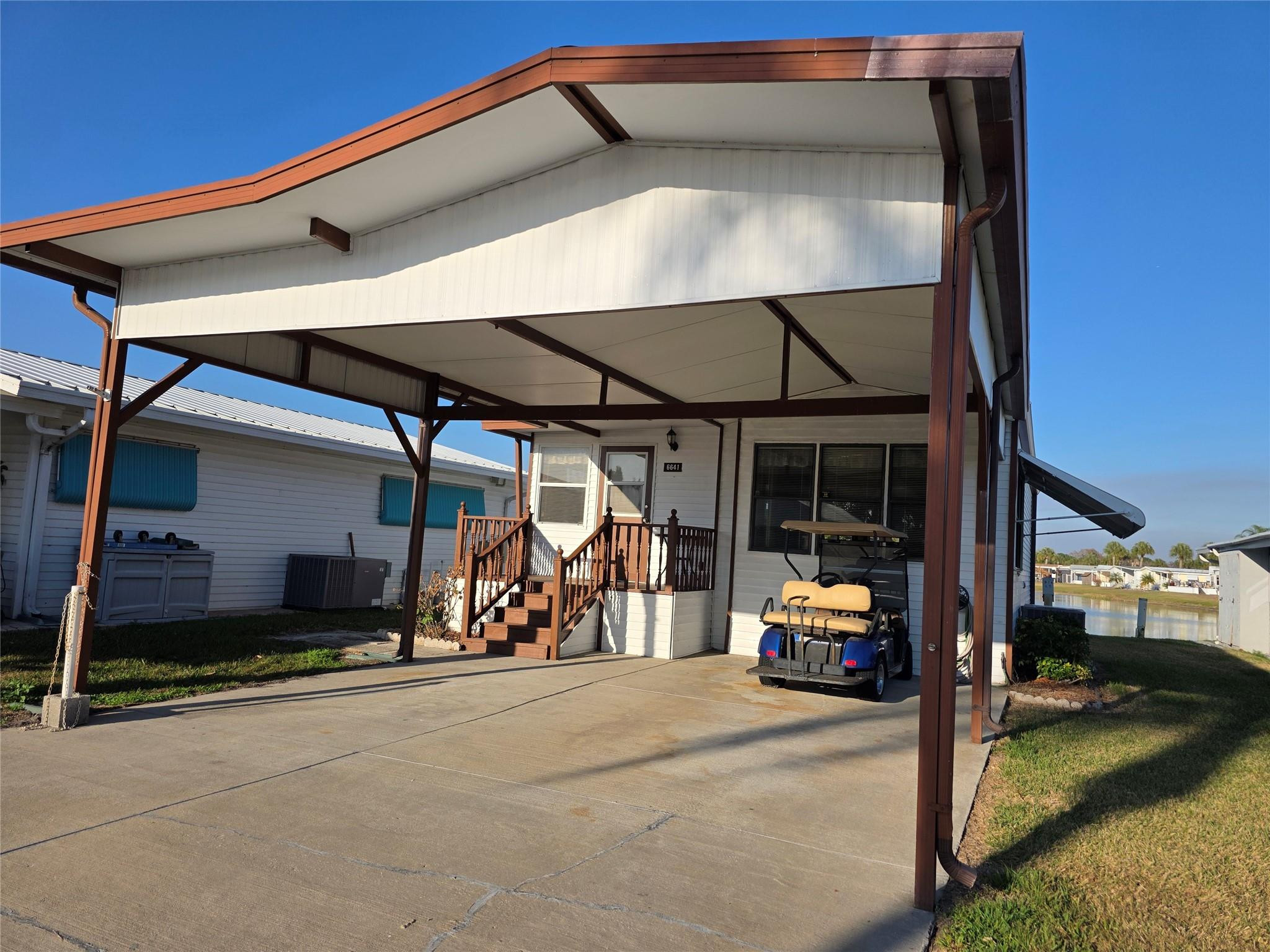 Welcome to this charming one-story mobile home situated in the Ancient Oaks RV Residence community in Okeechobee, Florida. This waterfront property offers 769 square feet of finished living space with two bedrooms and one bathroom, providing functional comfort for various living needs. Located in an established residential community, this home presents an opportunity to enjoy waterfront living at an accessible price point. The efficient floor plan maximizes usable space, making it practical for downsizing or investment purposes. This waterfront property in Ancient Oaks RV Residence represents a unique opportunity in the Okeechobee market. Incudes a golf cart
