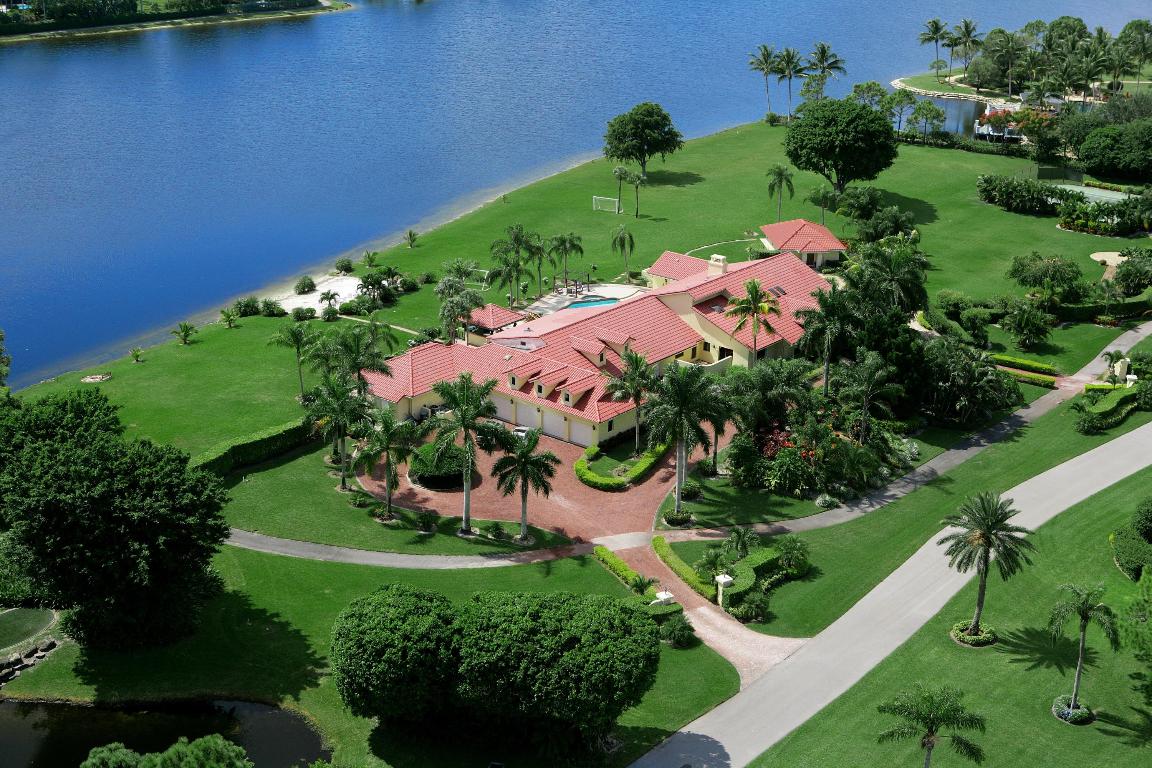Amazing opportunity to live in one of the most prestigious communities in Boca Raton. 
Existing home has 9,172 SF under air with beautiful views and direct access to the main lake. Property  includes tennis courts, a large swimming pool and a 4.75 acre lot that can be divided into two separate folios and a second house can be built on the empty lot where the tennis court is currently located. Le Lac is known for its serenity, tranquility and privacy. Idyllic lake front enclaves stretches across 200+ lush acres with only 32 multi acre estates surrounded by 75+ acres of interconnected lakes.
