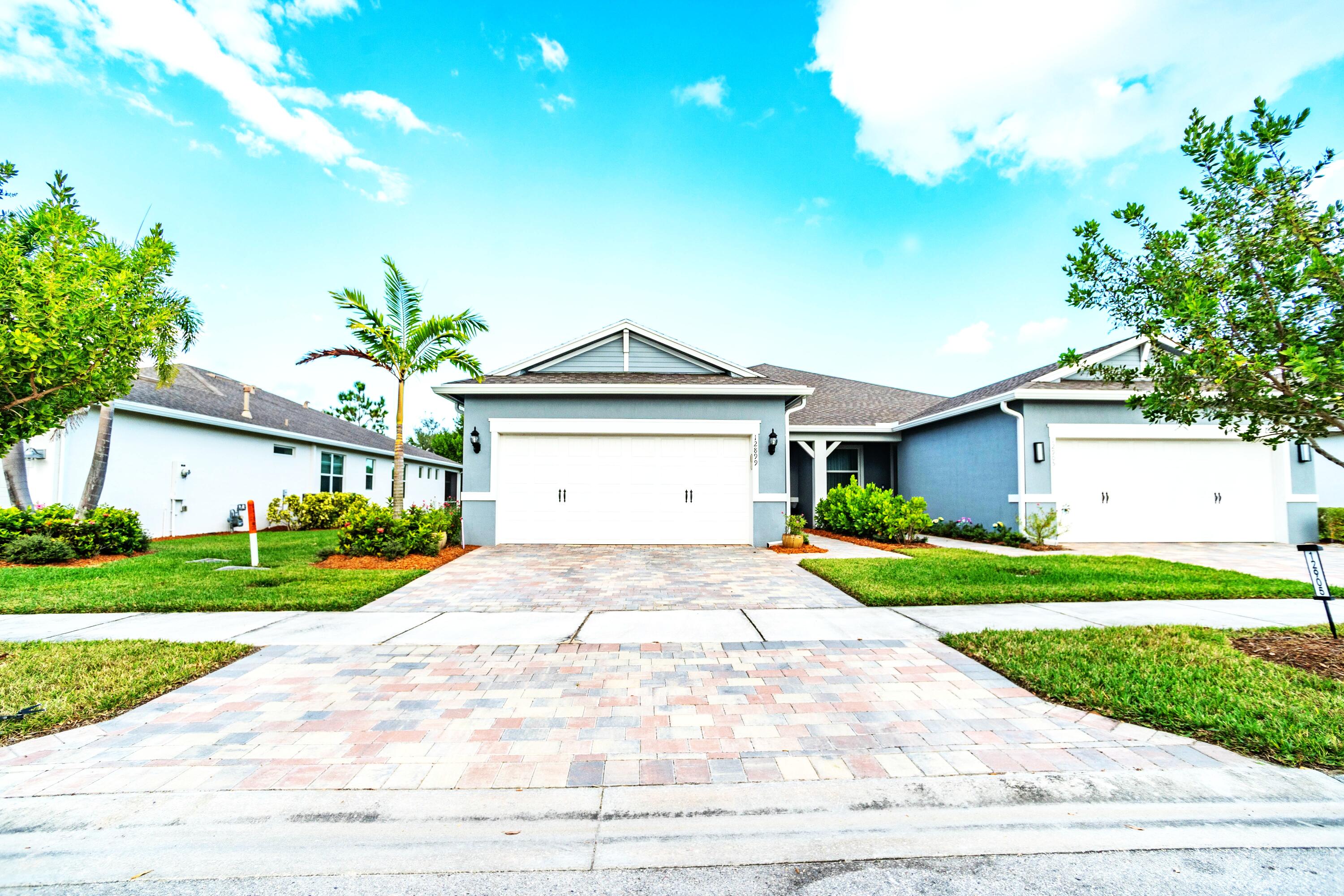 WOW! New Price Reduction at Only $343,900. This Villa offers modern elegance & comfort in the heart of Del Webb at Tradition's active 55+ community. The gourmet kitchen features 42'' cabinets w/ soft close draws, quartz countertops, a large island, stainless steel appliances & tile flooring throughout the whole house. The spacious master suite includes a luxurious bath w/ dual sinks, walk-in shower w/ frameless glass doors & a generous walk-in closet. A versatile flex room w/ double doors provides the perfect space for an office or den & a large laundry room w/ washer & dryer  that convey w/ the purchase. Enjoy a screened patio under truss overlooking a private backyard. Experience resort style living in Del Web! Priced to Sell! A Must See!