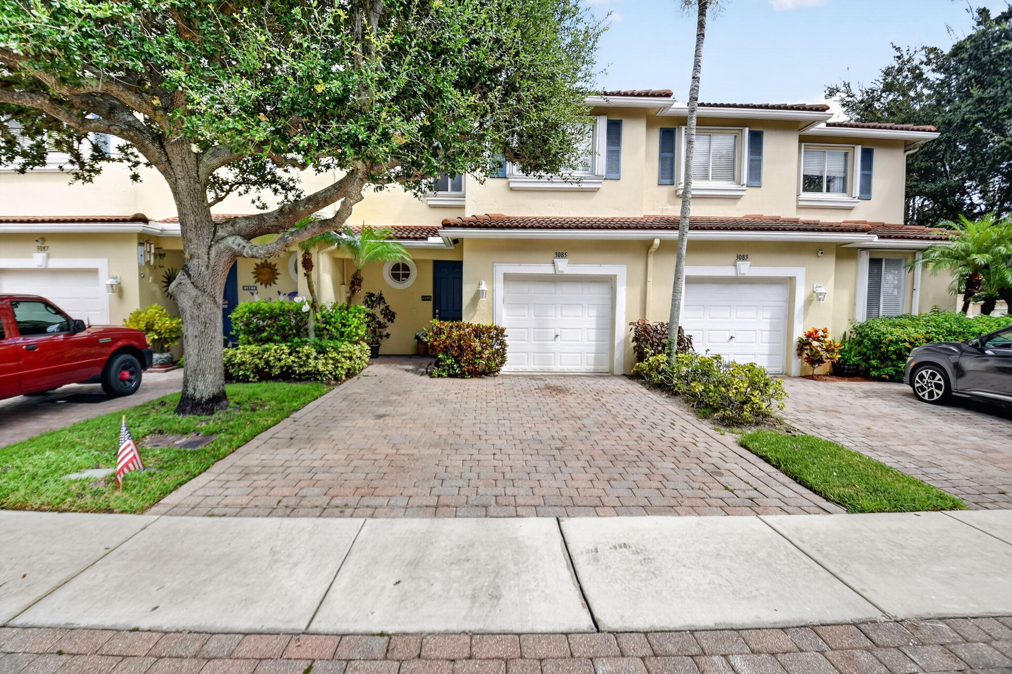 Welcome to this spacious three-bedroom, two-and-a-half-bath townhouse located in Quantum Park Townhomes in Boynton Beach. This two-story home offers brand new luxury vinyl plank flooring downstairs and brand new carpet on stairs and landing.  The entire house has been recently painted  with crown moldings throughout and new baseboards downstairs.There is a convenient one-car garage parking and expanded paved back patio.The ac is 6 years old and kitchen has stainless steel appliances the stove being replaced a year ago. The upstairs primary bathroom with walk in shower was replaced10 years ago and the 1/2 bath downstairs is brand new with new toilets throughout the house.The lighting and fans downstairs are all brand new .The townhouse  is protected from storms with  accordion shutters.  Please note that there is a new roof  replacement project. The planned start date is November of this year. Next month, they will be having a special assessment meeting to pass the assessment and then everyone will receive a letter in the mail with the payment amount which will probably be due by November 1st, 2026. The projected cost per unit will be $15,000-$20,000 but we expect it will be closer to $15,000