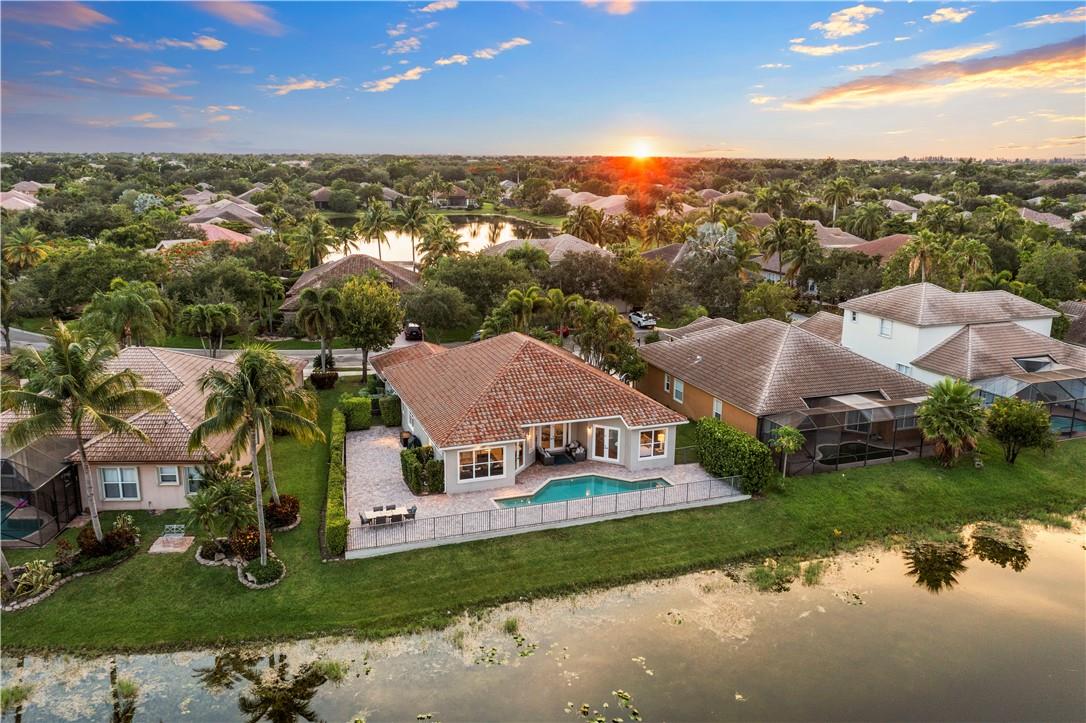$140K In Professionally Designed Upgrades! Stunning Open Waterfront Lot! Split Floor Plan, 2019 Roof & Gutters, Custom Built-In Wine Room w/Lights & Wine Fridge, Real Wood Beams, Updated Kitchen w/Quartz Counters, Pendant Lights, Stainless Steel Appliances, Backsplash, Newer Fixtures, LED Lights, & Window Treatments, Crown Molding, Built-In Family Room w/Floating Cabinets & Custom Porcelain Stone Wall Unit, Primary Bed Walk-In Closets w/Built-In's, 4th Bed Used As Built-In Office, Newer A/C Unit, 2022 Rheem Water Heater w/Booster, New Laundry Room w/Shaker Cabinets, Quartz Counters, New Washer & Dryer, Extended Paved Patio Area, Take In The Sunsets, A-Rated Schools, Resort-Style Clubhouse, 24-Hour Guard Gate, Low HOA Includes Comcast High Speed Internet, Cable,ADT Alarm System.
