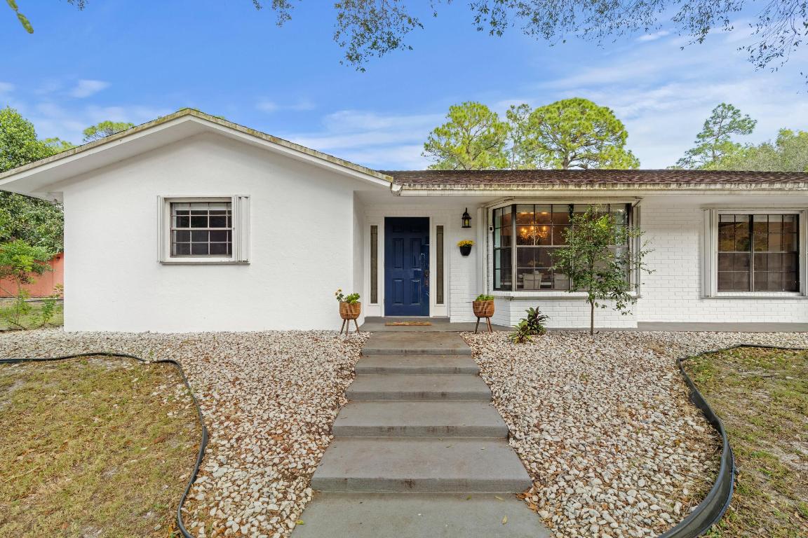 With two houses on two acres, enjoy the luxury of a guest house for your friends and family or choose to benefit from the rental opportunity.  The main house is 3019 total square feet and the second home is 1040 total square feet. This well maintained, move in ready home, offers a main house with four bedrooms, two and a half baths with garage, as well as a salt water pool. The second home, offers one bedroom and one bath with a garage. The land consists of numerous fruit trees including several varieties of Avocado and Mango just to name a few. The property is move-in ready, with raised garden beds and chicken coops. The property boasts two separate driveway entrances. Both homes can be offered furnished or unfurnished. Bring the kids, the animals and the inlaws for a tour, this dream home will not last long!