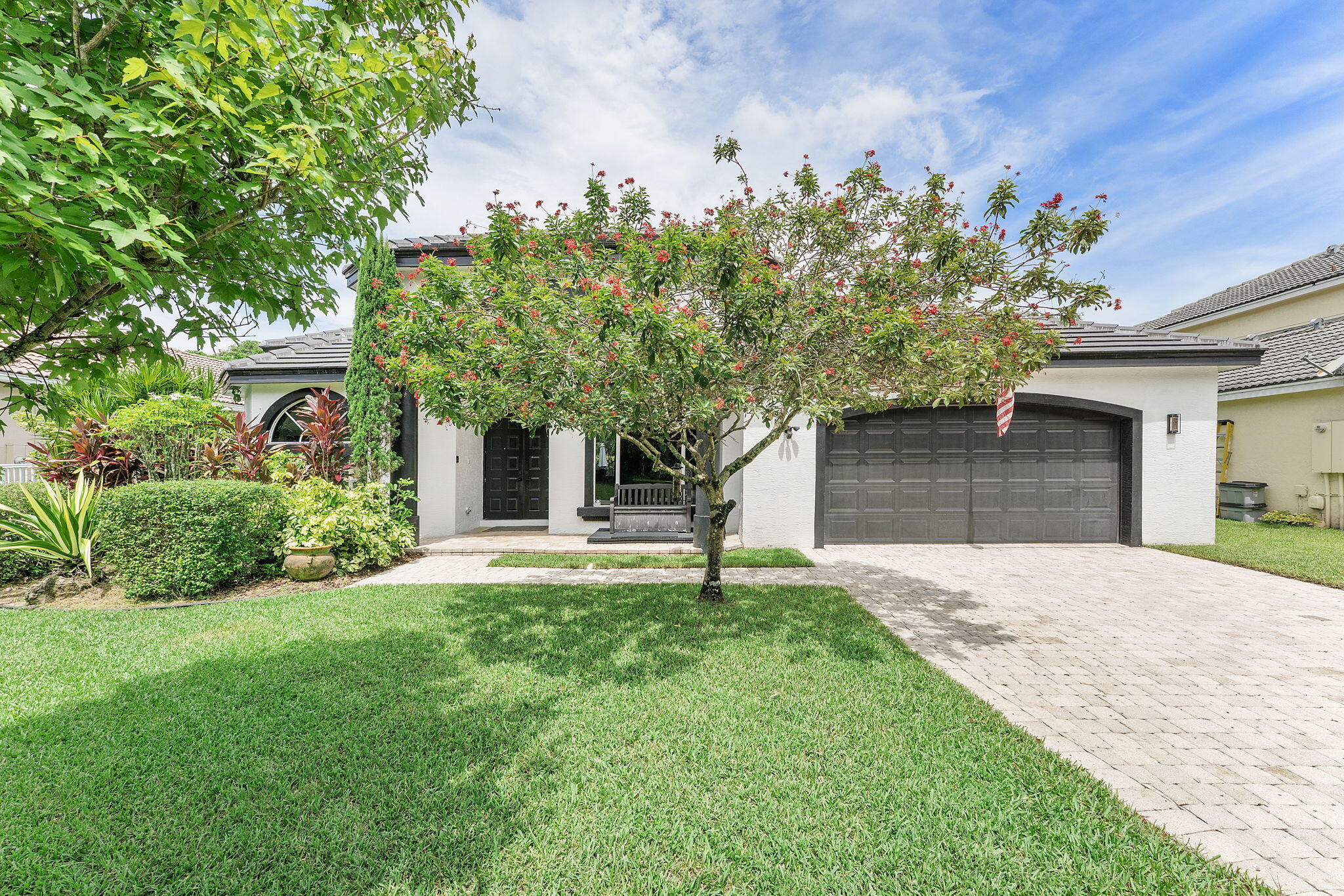 Tucked away on a quiet cul-de-sac in an intimate enclave of just nine homes, this beautifully updated 3 bedroom, 2 bath home with a versatile flex office offers the perfect blend of comfort, privacy, and Florida living - with NO HOA. A new black tile roof (2024) add a nice modern curb appeal, while inside the home you'll find an upgraded kitchen and renovated primary and guest bathrooms featuring quartz finishes (2024). The designed layout offers bright and inviting living spaces and the flexibility of a dedicated home office, playroom, or additional guest space. Step outside to your own backyard retreat, where you can relax by the pool while overlooking a quiet canal. The heated pool and spa is perfect for entertaining and truly enjoying Florida living at its finest. Coming soon 7.17.26