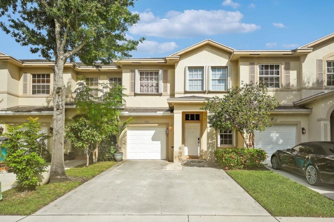 Beautifully renovated 3-bedroom, 2.5-bathroom townhome in the desirable gated community of Cedar Ridge in Boynton Beach! This move-in-ready home features an open kitchen with white cabinetry, quartz countertops, new stainless steel appliances, a walk-in pantry, extended island, and additional cabinetry. Enjoy stylish upgrades including tile flooring downstairs, laminate wood flooring upstairs, recessed lighting, knockdown ceilings and walls, and an epoxy-coated 1-car garage with plenty of driveway space.  Relax in the screened-in patio overlooking a private, garden-like fenced yard. Additional highlights include accordion hurricane shutters, NEW A/C, 2022 roof, full-size washer and dryer, and a beautifully renovated primary bathroom with dual sinks, rain showers, and a spacious walk-in closet.  Cedar Ridge offers a gated community lifestyle with a pool and clubhouse. Conveniently located near I-95, shopping centers, restaurants, and the airport. FHA and VA buyers welcome! An exceptional opportunity for first-time homebuyers, seasonal residents, or anyone seeking a stylish, low-maintenance home. A perfect blend of comfort, convenience, and Florida living!