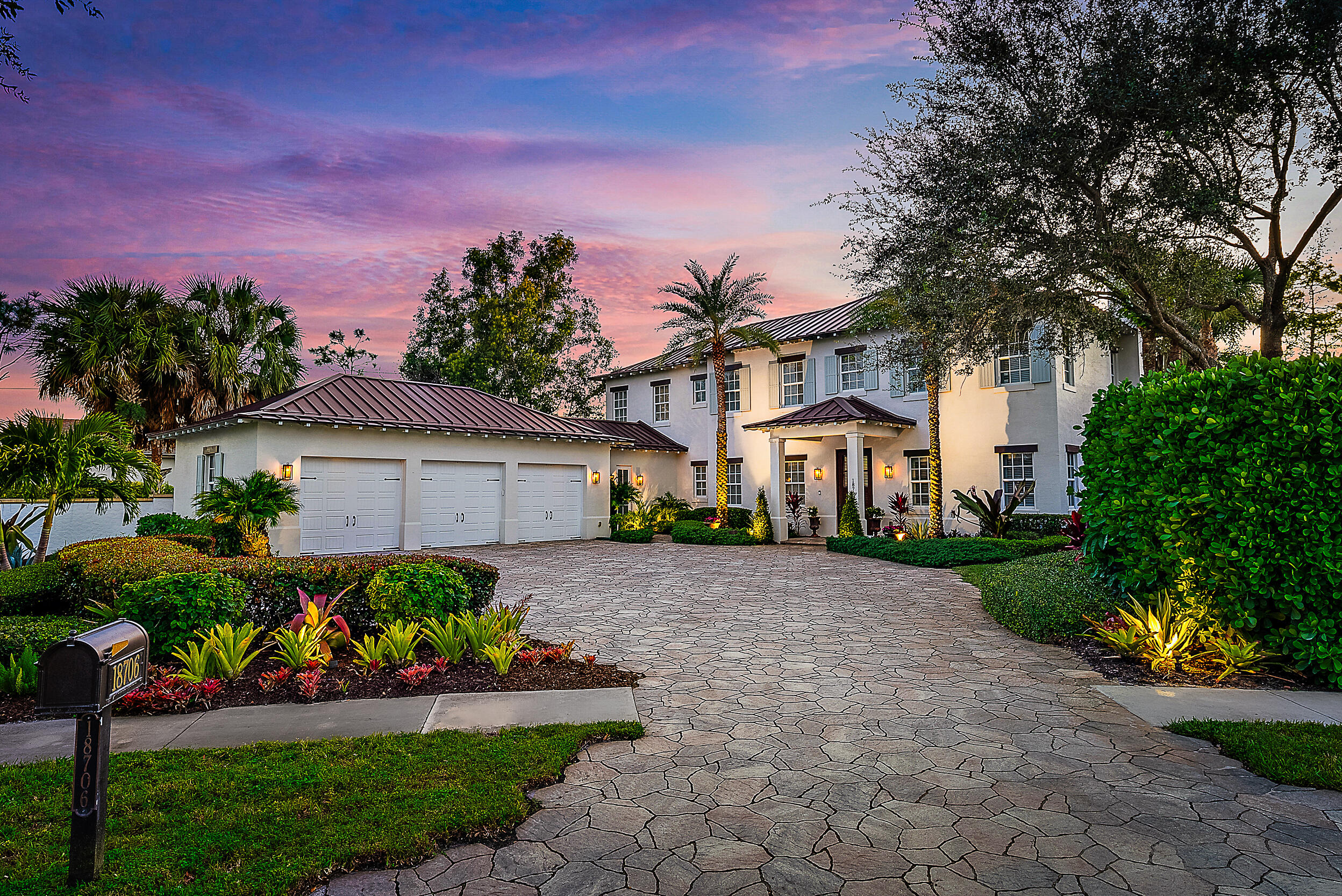 Discover elevated waterfront living in Old Cypress Point, a private gated enclave offering exceptional privacy. This British West Indies-inspired residence, built in 2012, features four ensuite bedrooms, four-and-a-half baths, thoughtfully designed for refined coastal living. Notable features include a 3 car garage, a full-house generator, impact windows and doors and sweeping waterviews. The outdoor setting rivals a luxury resort, showcasing a pool and spa, summer kitchen, private dock, and lush tropical landscaping creating a serene retreat. Inside, wide-plank wood floors highlight elegant living and dining spaces with a fireplace and French doors opening to covered patios. The chef's kitchen offers quartz countertops, an oversized island, and walk-in pantry. Don't miss this opportunity