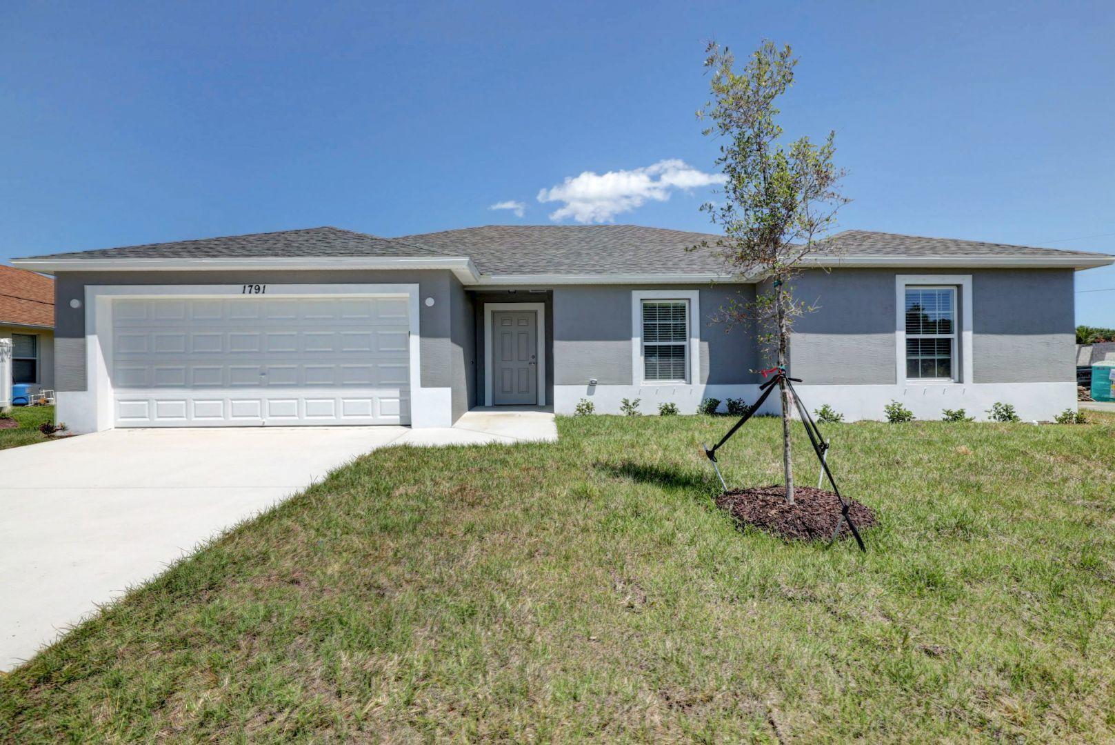 THE POPULAR BILTMORE MODEL BUILT BY AWARD WINNING SYNERGY HOMES. A 4/2/2 WITH 1806 SQ FT OF LIVING AREA.  A TRUE 4 BEDROOM, NO WASTED SPACE. STAINLESS STEEL APPLIANCES, SOLID SURFACE COUNTER TOPS IN KITCHEN AND BATHROOMS. UPFRADED TILE IN LIVING AREAS, UPGRADED CARPET IN BEDROOMS. WASHER AND DRYER INCLUDED. EXCELLENT LOCATION, EASY ACCESS TO I-95 AND FLORIDA TURNPIKE , A STONE THROW AWAY FROM POPULAR TRADITION AREA. HOME IS 4 YEARS NEW!! SHOW AND SELL!!