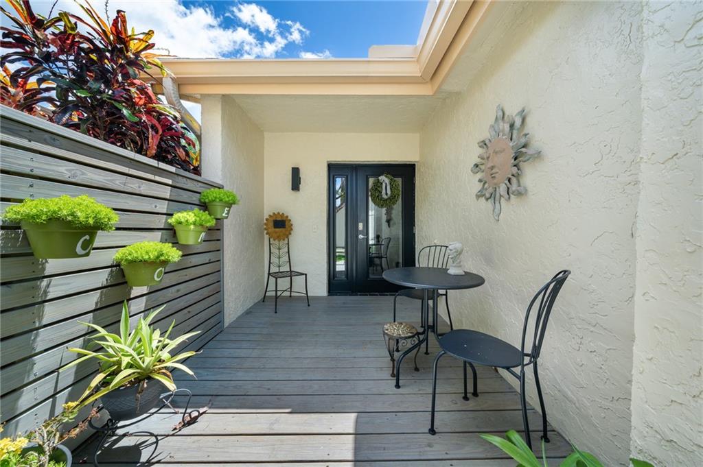 THE PERFECT REMODEL*PHOTOS ARE A MUST SEE*TOTALLY  OPEN FLOOR PLAN HOME*WOOD LOOK TILE FLRS*FANTASTIC BRIGHT NEW KITCHEN W/ISLAND COUNTER SEATING*QUARTZ COUNTER TOPS*ALL NEW APPLIANCES & AIR COMPRESSOR*LARGE DEEP STAINLESS STEEL SINK, CONVECTION/MICROWAVE OVEN* CERAMIC COOK TOP*PLENTY OF EASY SLIDE OUT DEEP CABINET STORAGE, BUILT IN RECYCLE BINS*WINDOW OVER SINK W/ LAKE & GARDEN VIEW*IMPACT WINDOWS & GLASS DOORS*DESIGNER CLOSET SYSTEM FOR MAXIMUM STORAGE ELIMINATES THE NEED FOR CHESTS & DRESSERS*HUGE FLORIDA ROOM W/ SLIDERS TO SPACIOUS OPEN TILED DECK*CORNER HOME SERENE WATER VIEW & EASY ACCESS TO COMMUNITY AMENITIES INCLUDING HEATED POOLS, FITNESS CENTER, CLUBHOUSE W/CARD, GAME & EXERCISE ROOMS*WORKSHOP*WALKING & BIKING PATHS*CLOSE TO SHOPPING, BEACHES & CASINOS*THIS VILLAGE IS 55+*