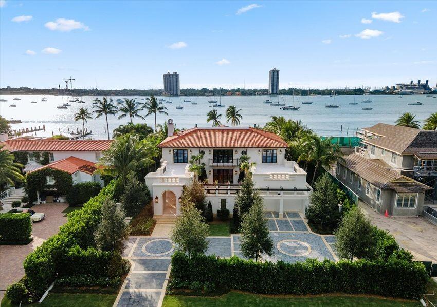 Completed new construction direct Intracoastal estate residence with concrete dockage. Stunning Art Deco styled residence with several ''flex'' rooms featuring walk-in closets and full baths allowing as many as 6 bedrooms/baths. Heavily landscaped grounds with multiple outdoor entertainment areas - courtyards and fountains. Motor court. HVAC oversized garage. Dramatic pool area - complete privacy from bike path. Steps to Palmo - Town Park and fantastic beach. Huge second story patios invite the best of indoor/outdoor living. Dream kitchen, dining seats 12-14 and dramatic visible wine storage. High elevation. Turn-key staged. Furniture available in whole or part, separately from stager. We are pleased to present this property which features several flexible spaces that can be crafted to suit your families particular needs and taste.