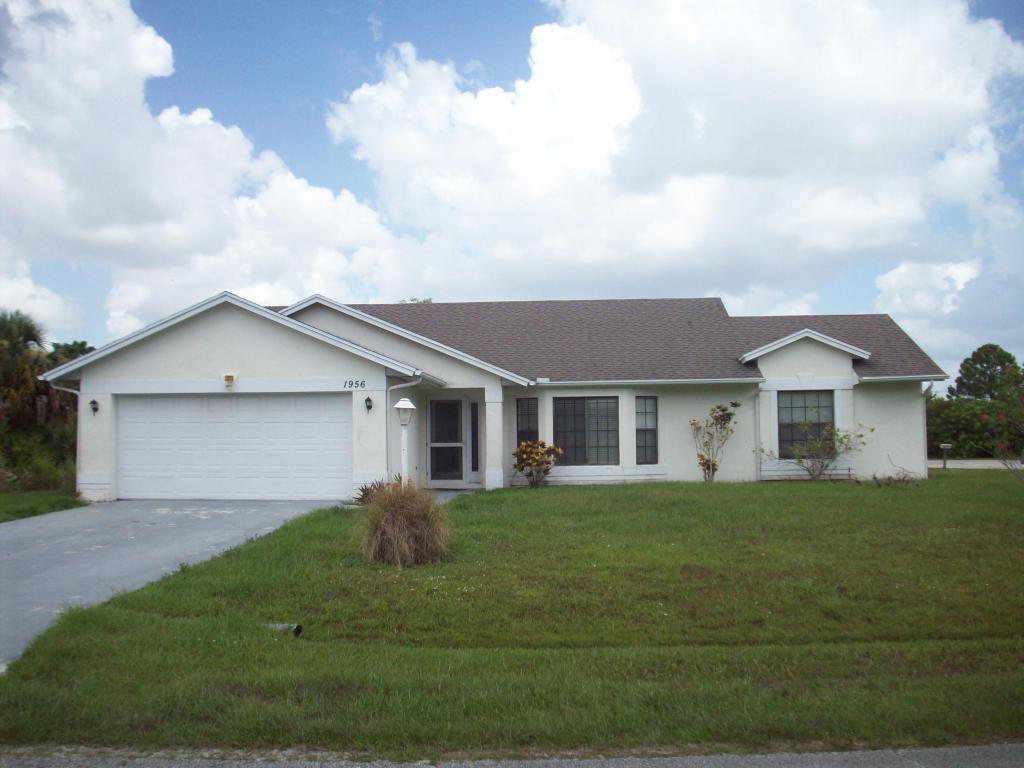 3/2/2 with Screened Porch and Tile Throughout.  Exterior Of Home Is Being Painted.  Split Bedroom Plan with Garden Tub, Shower and Dual Sinks in Master Bath.