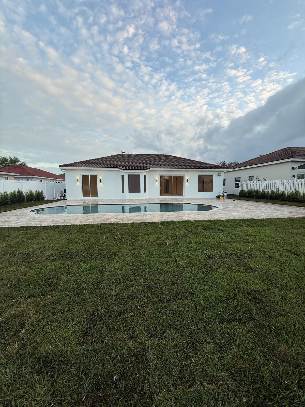 SPECTACULAR, MOVE-IN READY POOL HOME THAT HAS BEEN COMPLETELY RENOVATED AND REMODELED, FEATURING 5 BEDROOMS, 3 FULL BATHROOMS, A RARE 3-CAR GARAGE, AND A DEEP DRIVEWAY WITH PLENTY OF ROOM FOR MULTIPLE VEHICLES, THIS IS ONE OF THE FEW SINGLE-STORY 3-CAR GARAGE HOMES IN OAKRIDGE. THE SPACIOUS FLOOR PLAN IS ENHANCED BY BRAND NEW IMPACT WINDOWS THROUGHOUT, A MAGNIFICENT UPDATED CUSTOM KITCHEN, AND AN OVERSIZED SALTWATER POOL!! SITUATED ON AN EXPANSIVE BACKYARD LOT, THIS HOME OFFERS AN EXCEPTIONAL COMBINATION OF SPACE, UPGRADES, AND LOCATION. AN EXCEPTIONAL OPPORTUNITY TO OWN A BEAUTIFULLY UPDATED HOME IN ONE OF HOLLYWOOD'S MOST DESIRABLE NEIGHBORHOODS.