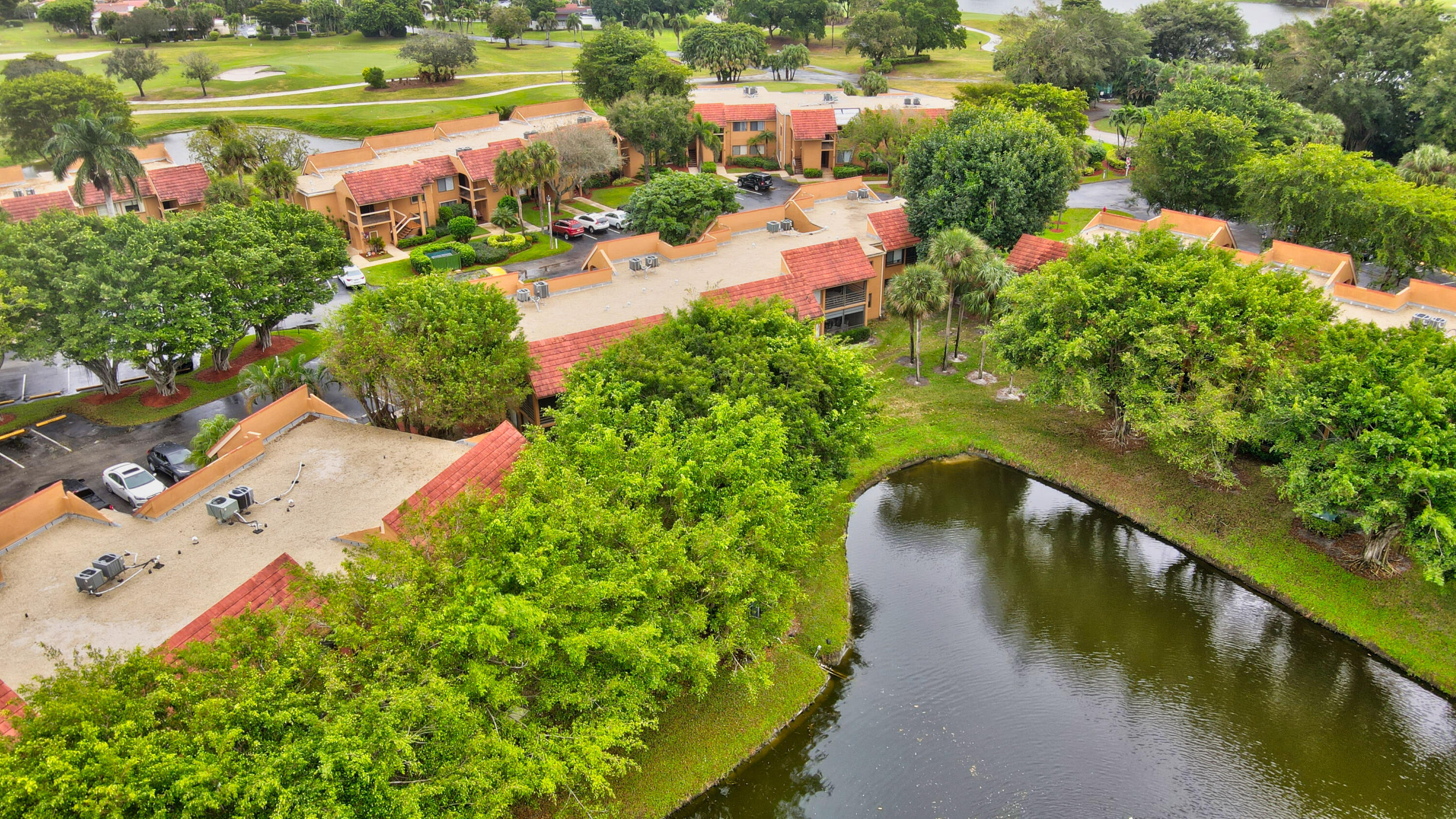NEW ROOF, NO MANDATORY  MEMBERSHIP FEES, NO ASSESSMENTS, 55+ COMMUNITY! Updated 2BR/2BA condo in the gated Indian Spring / Green Lakes community with serene lake views from a private screened lanai. Features include new laminate flooring, new vanities, modern ceiling fans, new bath fans, new stove, and in-unit washer/dryer. Steps to the pool and tennis courts, plus walking distance to houses of worship. Peaceful community close to shopping, dining, and entertainment. HOA $632 includes basic cable & internet. Minimum credit score 659.