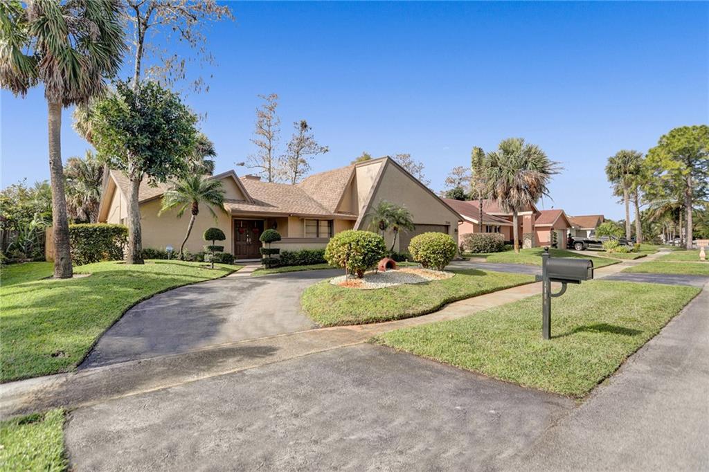 This 3/2 home features a circular driveway, large covered screened-in patio, hurricane shutters, tile throughout, large walk-in closet in master, foyer entrance, formal dining room, eat in kitchen, new flooring in kitchen. The house was painted in 2021. There is also a real fireplace. Close to shopping & dining. Home is sold AS IS. Mask must be worn while viewing the property.