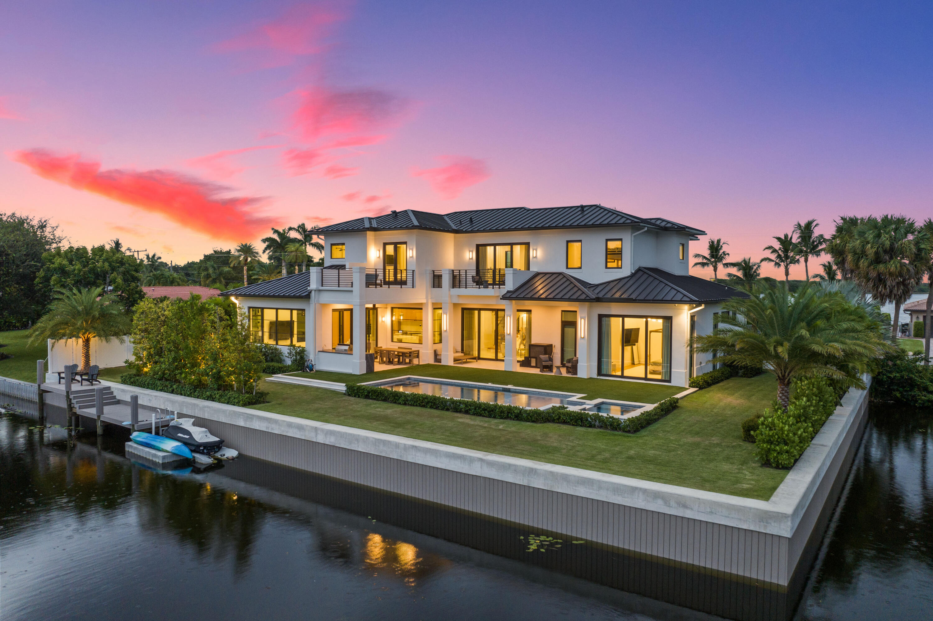 A rare south-facing point lot on Lake Shore Drive meets masterful design by Carrie Lee & Gulfstream Builders.  This new construction estate pairs architectural elegance with cutting edge control 4 technology.  Voluminous interiors, wolf-appointed chef's kitchen, Lutron lighting, and a sleek marble trimmed gas fireplace flow to an outdoor paradise with saltwater pool, jacuzzi, summer kitchen and covered loggia.  Three balconies capture sparkling Lake Ida views, while a seawall and private dock grant effortless access to the water.  An address of distinction for the most discerning buyer. Live the quintessential Lake Ida lifestyle here, with direct access to the endless recreational pleasures of Lake Ida & Lake Eden.  Launch your paddleboard, kayak, or boat right from your own private dock.