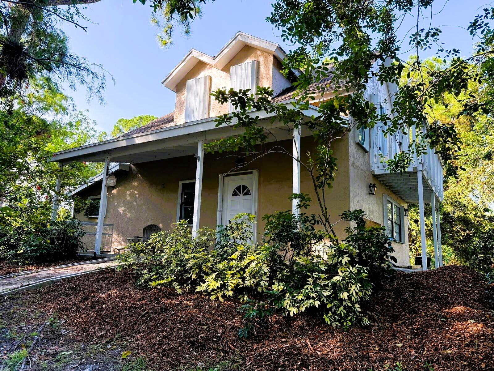 3-bedroom, 3.5-bath home on 1.36 acre lot in desirable Loxahatchee. This is far from a cookie-cutter home. Two primary suites with private en-suite bathrooms—one conveniently located on the first floor and another upstairs—this property offers flexibility for guests or multigenerational living. Warm wood ceilings and exposed beams create an inviting atmosphere throughout. Freshly painted with new luxury vinyl flooring. The kitchen features granite countertops, breakfast bar seating, stainless steel appliances, and a large walk-in pantry. A full-size washer and dryer are located inside for added convenience. Step outside to enjoy the expansive deck overlooking the newly resurfaced inground pool. Property also includes a two-stall barn with a feed/tack room. Close to shopping.