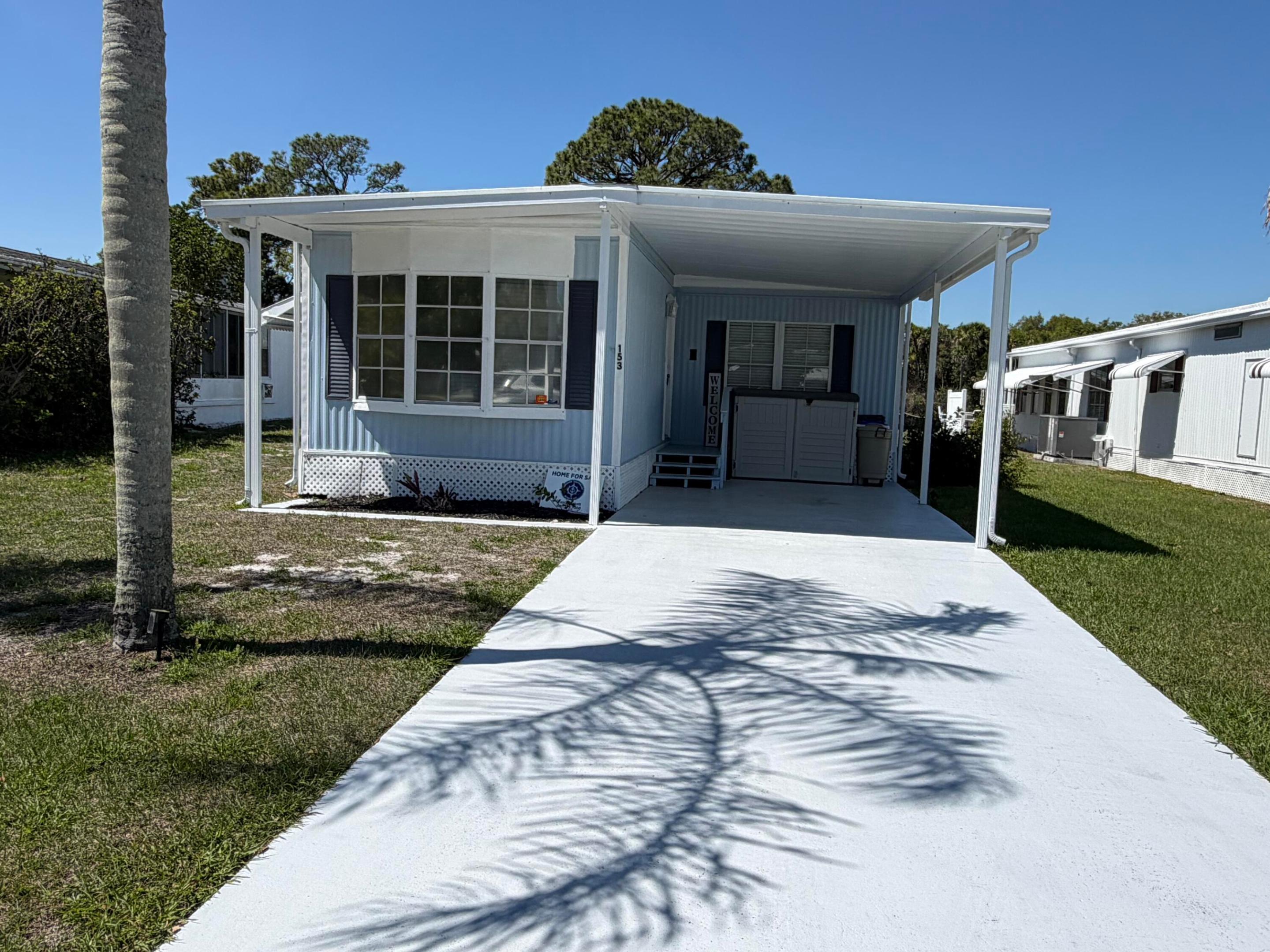 Are you ready for Florida Lifestyle at its best? Here at 153 Camino Del rio we have it all at your fingertips with breath taking views of the Saint Lucie River and all the amenities this 55+ community has to offer including fishing, golf, tennis, pickleball, boating, and close to beaches, civic center, hospitals, sports, dining, farmers markets you name it! This 2 bedroom, 2 bath home has been fully renovated with new water heater and appliances, updated baths and light fixtures, AC, some windows and new slider door, driveway and roof resealed, Back deck, and all new vinyl waterproof flooring throughout and new barn doors interior and exterior fresh paint and more. Owner motivated for quick sale. This is your opportunity to get this great deal and enjoy the views morning and  evening! This split layout offers large living area and den and lots of privacy for your guests. Offered unfurnished (all appliances remain). Furniture can be negotiable. All buyers must be resident approved for the lot fee of 1483 monthly! A minimal fee to enjoy a home on the river with all tax included in lot fee! Pictures do not do this view justice so come see for yourself and discover the beauty of nature today!! Call to schedule a private showing .