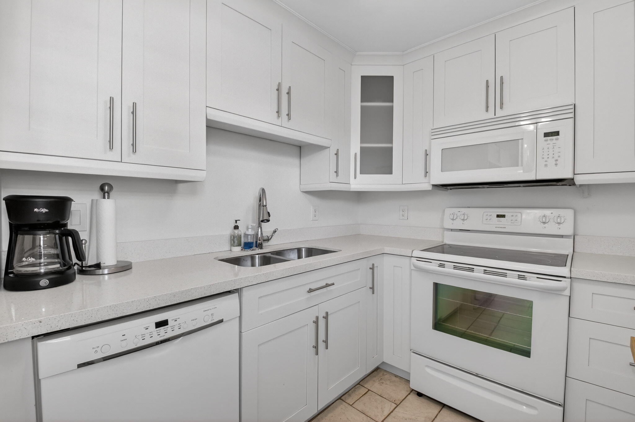 Discover coastal living at its finest in beautiful South Palm Beach! Why rent when you can own this light-filled, impeccably maintained 2-bedroom, 2-bathroom condo just steps from the beach? Located on the second floor, this move-in-ready unit features tile flooring throughout, an in-unit washer and dryer, and an updated kitchen complete with a window for added natural light. Offered fully furnished, it's perfect as a primary residence, vacation home, or investment opportunity. The spacious living and dining area opens to a large screened-in balcony overlooking the pool—ideal for relaxing or entertaining. Enjoy a prime location with easy beach access, nearby shopping, and excellent dining options. Just a short walk to local attractions and only 15 minutes from the airport.
