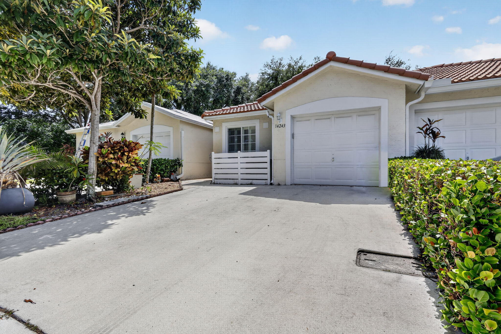Welcome to effortless South Florida living in Delray Beach! This beautifully renovated 2-bedroom, 2-bath villa at 14243 W. La Sedona Circle offers the perfect blend of modern style, comfort, and low-maintenance living. Step inside to soaring vaulted ceilings, an open-concept layout, designer finishes, and a stunning chef's kitchen featuring quartz countertops, custom cabinetry, stainless steel appliances, and a spacious island overlooking the living area. The oversized primary suite provides a peaceful retreat, the beautifully updated guest bath features a luxurious steam shower for a true spa-like experience, while the bright Florida room invites you to relax with lush tropical views. Major updates include a NEW tile roof (2025), impact windows (2023), and A/C (2024) for added peace of mind. The low $360/month HOA covers landscaping, exterior building maintenance, internet, trash service, community pool, and tennis courts. Ideally located near downtown Delray Beach, Atlantic Avenue, world-class dining, shopping, golf, and beautiful beaches, this move-in ready villa is perfect as a full-time residence or seasonal getaway. Just unpack and start enjoying the Florida lifestyle! Can rent right away. Rental restrictions are minimum of 30 days and maximum of 3 leases per a 12 month period.
