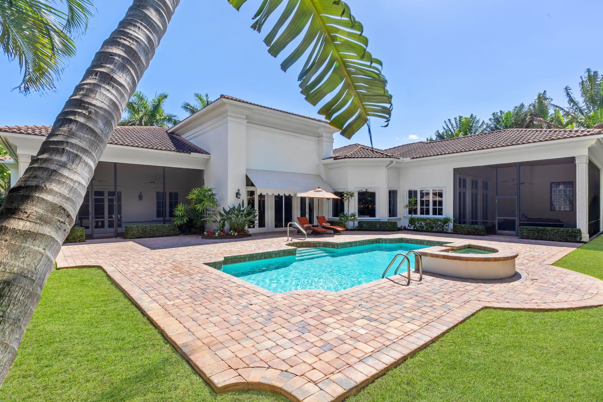 Introducing an extraordinary estate situated in The Sanctuary, one of Boca Raton's most coveted communities. This exceptional residence, nestled on one of the largest lots within the enclave, offers unparalleled luxury and privacy. Boasting over 6,600 square feet of air-conditioned space with soaring ceiling heights, this palatial home features 4 bedrooms, 4 full baths, and 2 powder rooms.
 
Upon arrival, a grand circular driveway sets the stage for the awe-inspiring entry. Passing through the dramatic rotunda foyer, adorned with exquisite architectural details, including chiseled limestone flooring and classic columns, you'll be captivated by the elegant ambiance. The heart of the home is a light-filled formal living room, seamlessly connected to the outdoor oasis through French doors, offering views of the resort-style pool and lush tropical gardens. An elaborate cast stone fireplace, granite-topped wet bar, and wine vault add to the allure of this magnificent entertaining space.
 
The gourmet island kitchen, outfitted with custom cabinetry and deluxe appliances, is a culinary masterpiece. A separate menu planning area and Butler's Pantry ensure seamless hosting of grand gatherings.
 
Outdoors, the expansive terrace envelops the resort-style pool and spill-over spa, providing the ultimate setting for al fresco entertaining amidst lushly landscaped tropical gardens.
 
One of the most desirable locations in Boca Raton, residents in The Sanctuary grants access to the community's basketball court, tennis court, and dock slips. Other amenities include nearby schools, and proximity to fabulous shopping and fine dining in Boca Raton, Delray Beach, and the greater Palm Beach area.
 
With its unrivaled elegance, luxurious amenities, and prime location, this estate epitomizes the pinnacle of Boca Raton living. Welcome home to timeless luxury and sophistication.

The information published and provided including but not limited to prices, measurements, square footages, lot sizes, features, finishes, and calculations are subject to errors, omissions or changes without notice.
All such information should be independently verified. All parties should perform their own due diligence to verify all information.