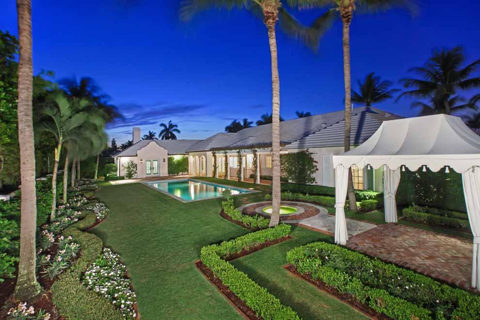 Extremely rare opportunity to own one of the most incredible beachside estates in the Exclusive Seaside Town of Gulf Stream. This property sits on a very large corner lot just a few homes from the Atlantic Ocean. Extremely well built, the home looks and feels like brand new construction and has been meticulously maintained inside and out. The property is being offered 100% turnkey and has just recently been decorated by renowned Interior Designer Phoebe Howard; there is not a space on this entire property that has not been selectively designed and decorated to perfection. This beach area estate is nestled in the exclusive Town of Gulf Stream just three homes from the Atlantic Ocean and one block to Gulf Stream School. Enjoy the convenient proximity to Delray Beach’s Atlantic Avenue, Palm Beach's Worth Avenue and Boca Raton's Mizner Park.  Upon arriving through the privacy wall's white fence entry, the arched front door leads to the foyer which sets the inviting tone for the interior with wood floors, white trim and paneling. The home is full of natural light and features tray and/or custom ceilings throughout. The formal living room has a fireplace and built-ins with entry to the formal dining room. The gourmet kitchen features state-of-the-art appliances with two Sub Zero refrigerators/freezers and Subzero wine closet; La Cornue gas range with ovens; and large island all under volume ceilings with custom barn-style exposed beams. The kitchen opens to the family room providing expansive views of the gardens and pool via French doors that lead to the loggia. The master suite is complete with fireplace, French doors opening to the terrace, built-ins and spacious master bath. There are also three additional en suite guest rooms as well as a den. Situated on an expansive one-half acre corner lot with a brick paver circular drive, the manicured grounds have been meticulously landscaped to create a private oasis complete with pool and garden gazebo with fountain. The open brick terraces and covered loggia are perfect for relaxing poolside and or entertaining guests. Other features include a large three car garage, full-house generator, spacious attic for storage and mechanicals, electric shutters, impact windows and doors, and built-in awning. The entire property is absolutely stunning from the perfectly designed interior to the incredibly landscaped exterior. One must view this property in person to truly understand the quality of lifestyle this home has to offer in the heart of Gulf Stream. Call for list of items excluded from sale.
