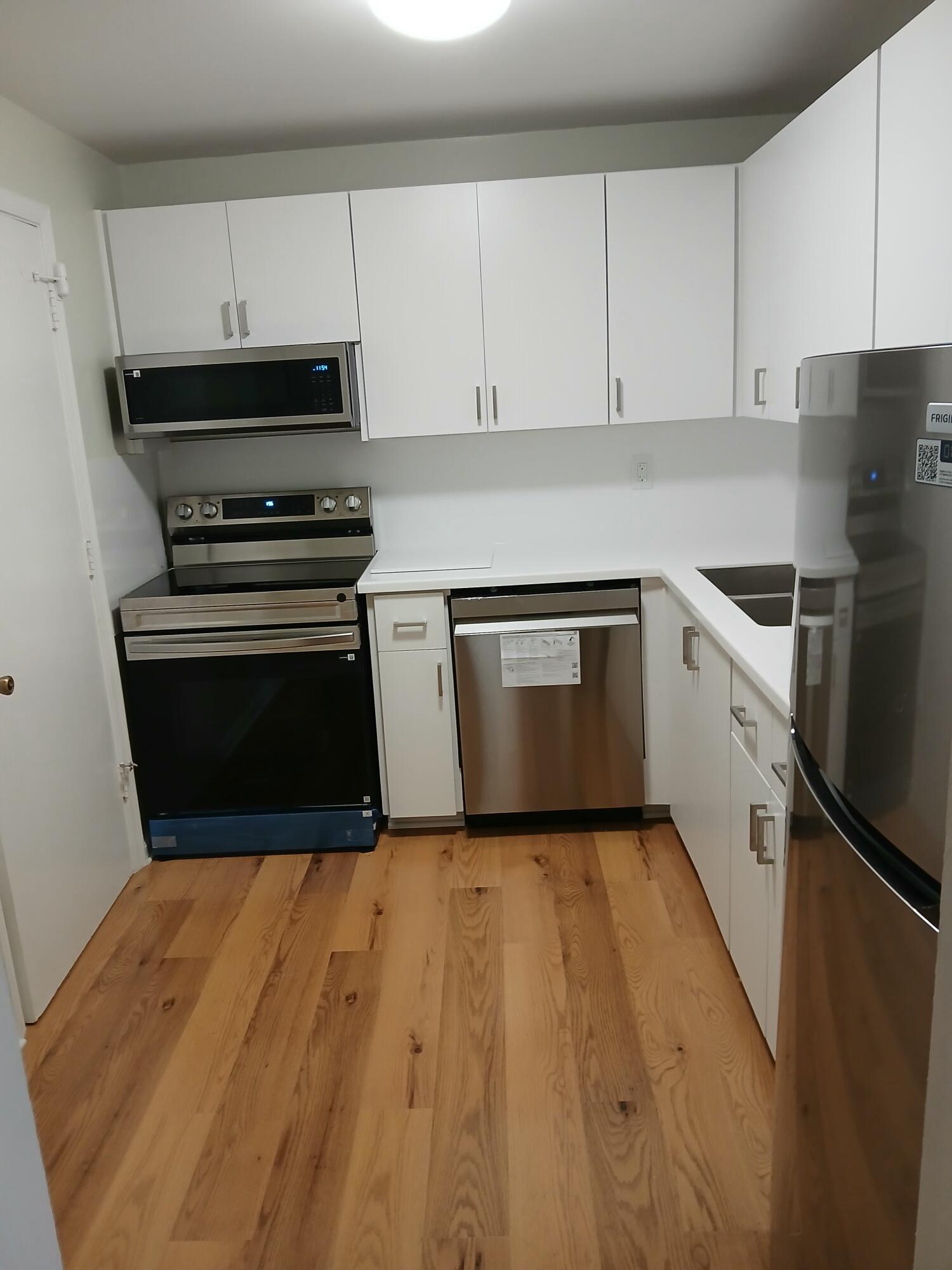 BEST DEAL IN COMPLEX..Unfurnished 2/2.. first floor BLDG, 7... newly painted Light.grey walls...white trim... new wood flooring throughout ENTIRE condo.. no tile or carpet.   new kitchen appliances and new  white cabinets  No  pets,, EZ2C...owner wants it rented ASAP to qualified tenent (700+cr.score).