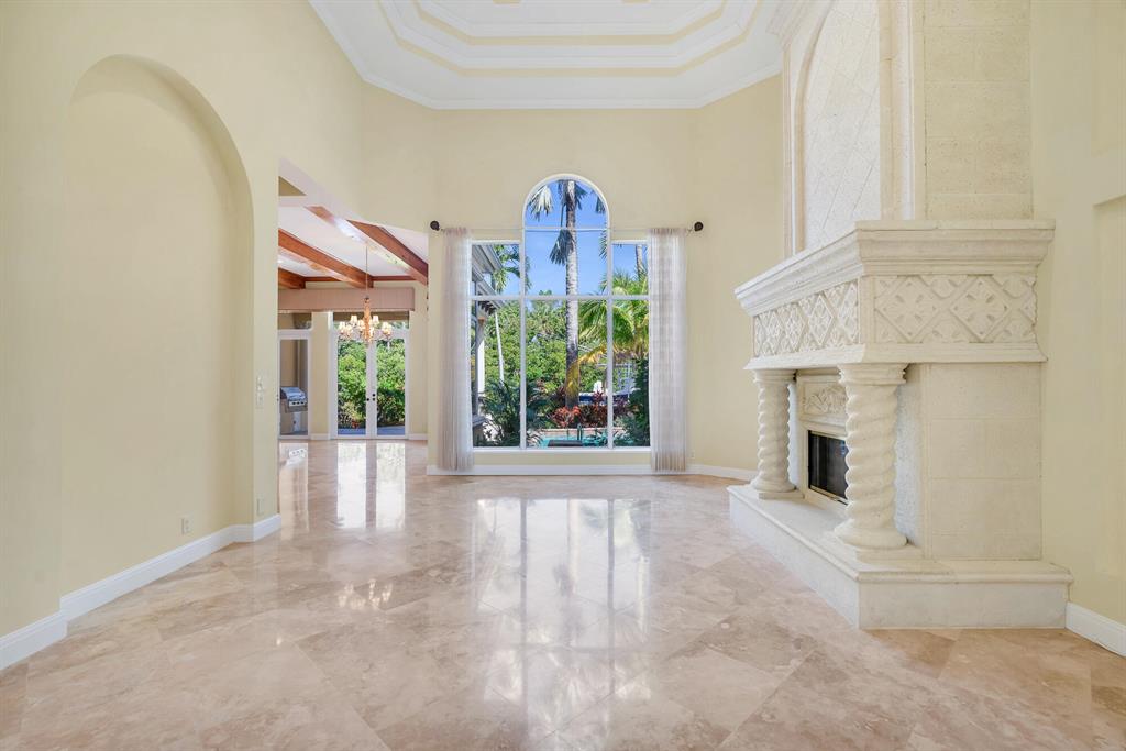 Located in Harbour Isles, this waterfront property is a boaters paradise situated on a deep water canal with no fixed bridges. The residence features 5,204 +/-total square feet with 4 bedrooms, 4.5 baths, a library, and a 3-car garage. The interior has spacious rooms, high ceilings, a fireplace, an eat-in kitchen with high-end appliances, hurricane impact doors and windows, Toto toilets, a central VAC system, and a gracious master suite with dual walk-in closets and an ensuite bath. Enjoy outdoor entertaining under the large covered loggia overlooking the canal, complete with summer kitchen. The waterfront pool and spa are surrounded by tropical landscape for added privacy. The 90 foot dock has a 16,000 lb boat lift, water and electricity. Harbour Isles is gated community on the water in North Palm Beach.  Ideally located in close proximity to the best restaurants in Palm Beach Gardens and Jupiter.  One can enjoy shopping at The Gardens Mall or boating to local waterfront restaurants in the area.