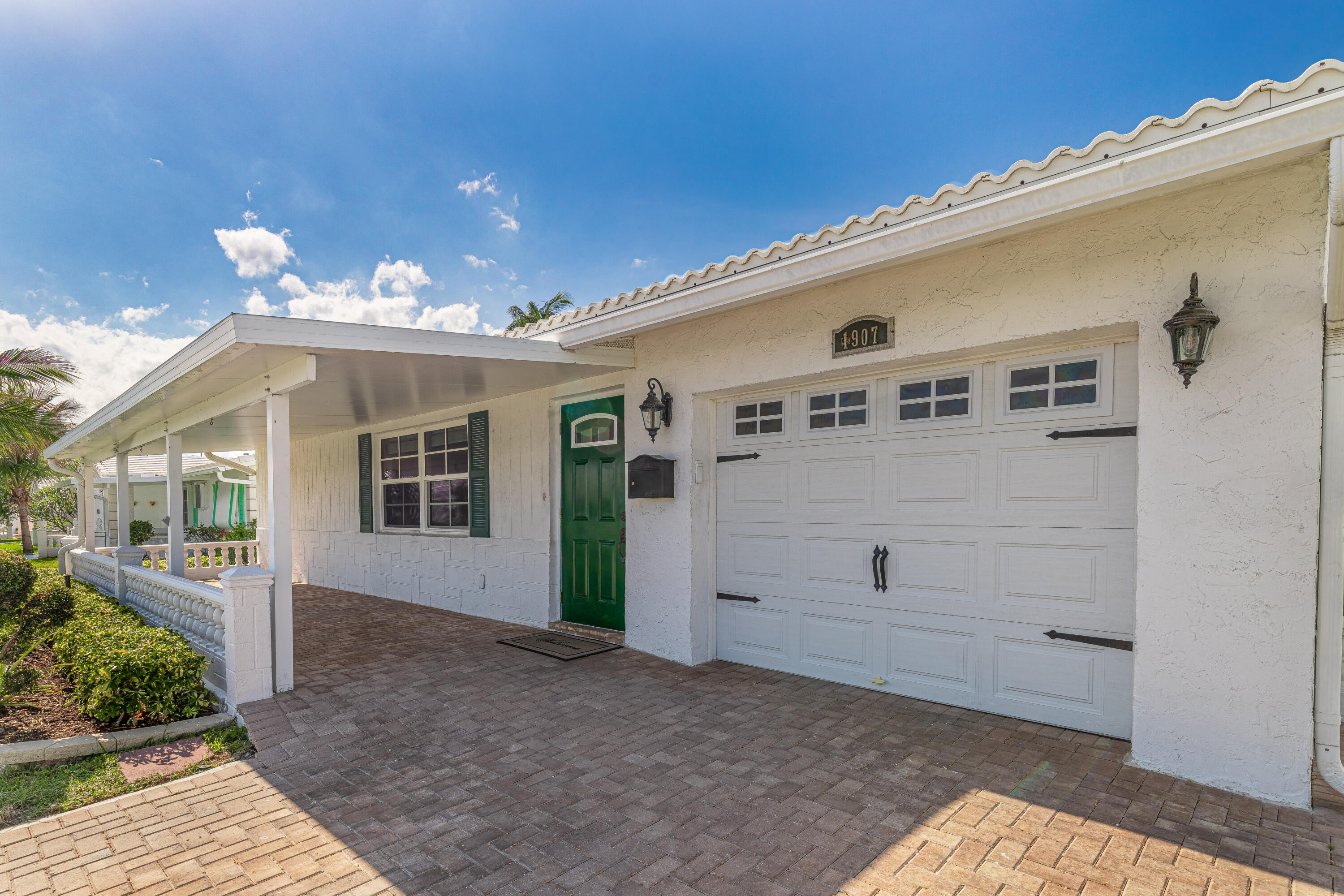 Located in the Active 55+ Community of Boynton Leisureville, this 3Beds 2Baths  exceptional home offers a range of modern improvements and amenities designed for comfort, convenience, and style. The remodeled kitchen is highlighted by a glass backsplash, providing a sleek and luxurious look that complements the culinary space. Designer bathrooms add to the home's upscale appeal, ensuring both functionality and elegance. Recent upgrades include a new air conditioner installed in 2025, ensuring efficient climate control throughout the residence. The roof was replaced in 2020, and the insulated front porch roof enhances energy efficiency while creating a welcoming entryway. Partial hurricane impact windows and doors provide security and peace of mind during severe weather conditions.  A Generac generator, newly installed in 2024, is connected to the entire home, offering reliable power during electric outages. Additional improvements such as a water heater installed in 2023 and tile and Pergo Laminate flooring throughout the house contribute to the home's overall comfort and durability. The property features an elegant and mature landscape, creating an inviting atmosphere as you approach the home. The landscaping not only enhances curb appeal but also stands as a point of pride within the neighborhood. This beautiful home is move-in ready, allowing you to immediately embrace the vibrant tropical lifestyle offered by Boynton Leisureville Community which provides residents with a wide variety of activities, including dinner dances, theater performances, musical shows, card games, pool exercises, yoga, and many other events. The popularity of these activities is evident, as all events tend to sell out quickly, making them highly anticipated and well-attended.  Residents enjoy convenient access to a range of local attractions. Within minutes, you can reach the beach, an array of restaurants, the renowned Kravis Center Opera House, and museums such as Flagler, Norton, and Mizner. The area also boasts numerous golf courses, shopping centers, movie theaters, and the famed Downtown Atlantic Avenue in Delray Beach. With so many options available, the choices for entertainment and recreation are truly endless.   Look No Further and DO NOT DELAY  Request a showing today.