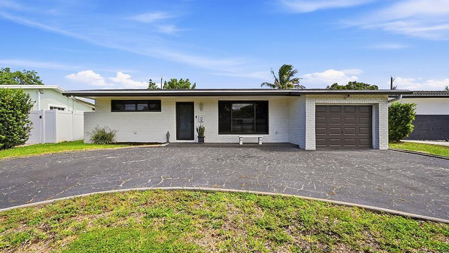Welcome to this beautifully updated home featuring modern upgrades and exceptional curb appeal! This move-in-ready property boasts brand-new hurricane-impact windows, doors, and garage door, providing both style and peace of mind. Enjoy the benefits of a new roof and tasteful updates throughout the home, creating a fresh and contemporary living space. Step outside to a spacious backyard, perfect for entertaining, relaxing, or creating your own outdoor oasis. Conveniently located and meticulously maintained, this home is ready for its next owner. Don't miss this incredible opportunity—schedule your private showing today!