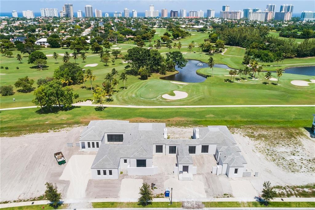 Under Construction! Located in The Enclave at Coral Ridge Country Club, this 5/5/2 sprawling 7417 sqft A/C (10,818sqft gross) one story custom estate is situated on a 35,614 sqft double golf course lot and showcases stunning golf course views of the club's renowned Robert Trent Jones, Sr. 18-hole championship golf course. The resort ambiance of this estate home begins with a waterfall framed entrance and is framed by lush garden courtyards. The designer and architect continue to integrate the lush garden courtyards into the interior space with large 11 foot glass windows and doors, giving the residence a private yet lush feel. The Enclave, located in east Fort Lauderdale, is an exclusive guard gated community featuring 36 residences. Late 2019 completion.