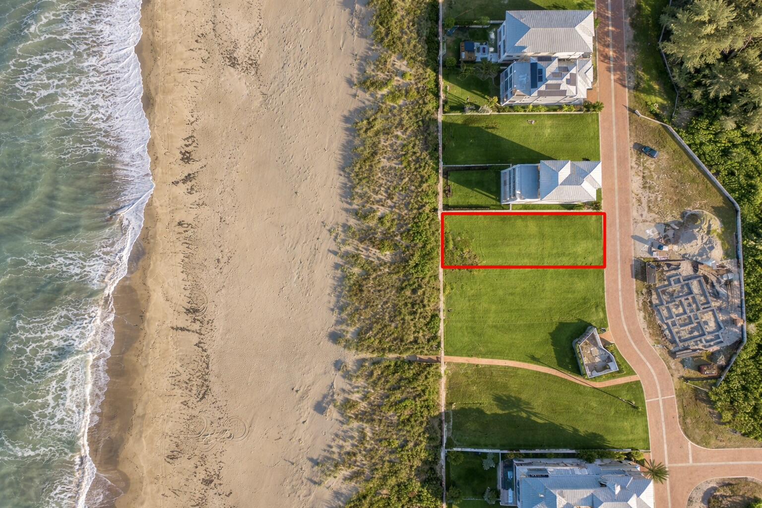 BACK ON MARKET (due to no Short-Term Rentals allowed. 1mo+ lease minimum). MOTIVATED SELLER and can share examples of building plans! BEAUTIFUL views and soothing sounds on this OCEANFRONT and RIVER VIEW lot in gorgeous Hutchinson Island. This vacant lot in the quiet, gated community of Watersong, offers the rare opportunity to bring your coastal dream home to life. You are only one lot away from the private community beach walkway so have your toes in the sand within minutes or enjoy a short walk to the relaxing community pool. Whether it's sunrise coffee on your private balcony or sunset strolls along the shoreline, every day can feel like a vacation while also only being 2 hrs south of Walt Disney World and all Orlando theme parks or 2 hrs north of Miami. Welcome to the FL lifestyle!