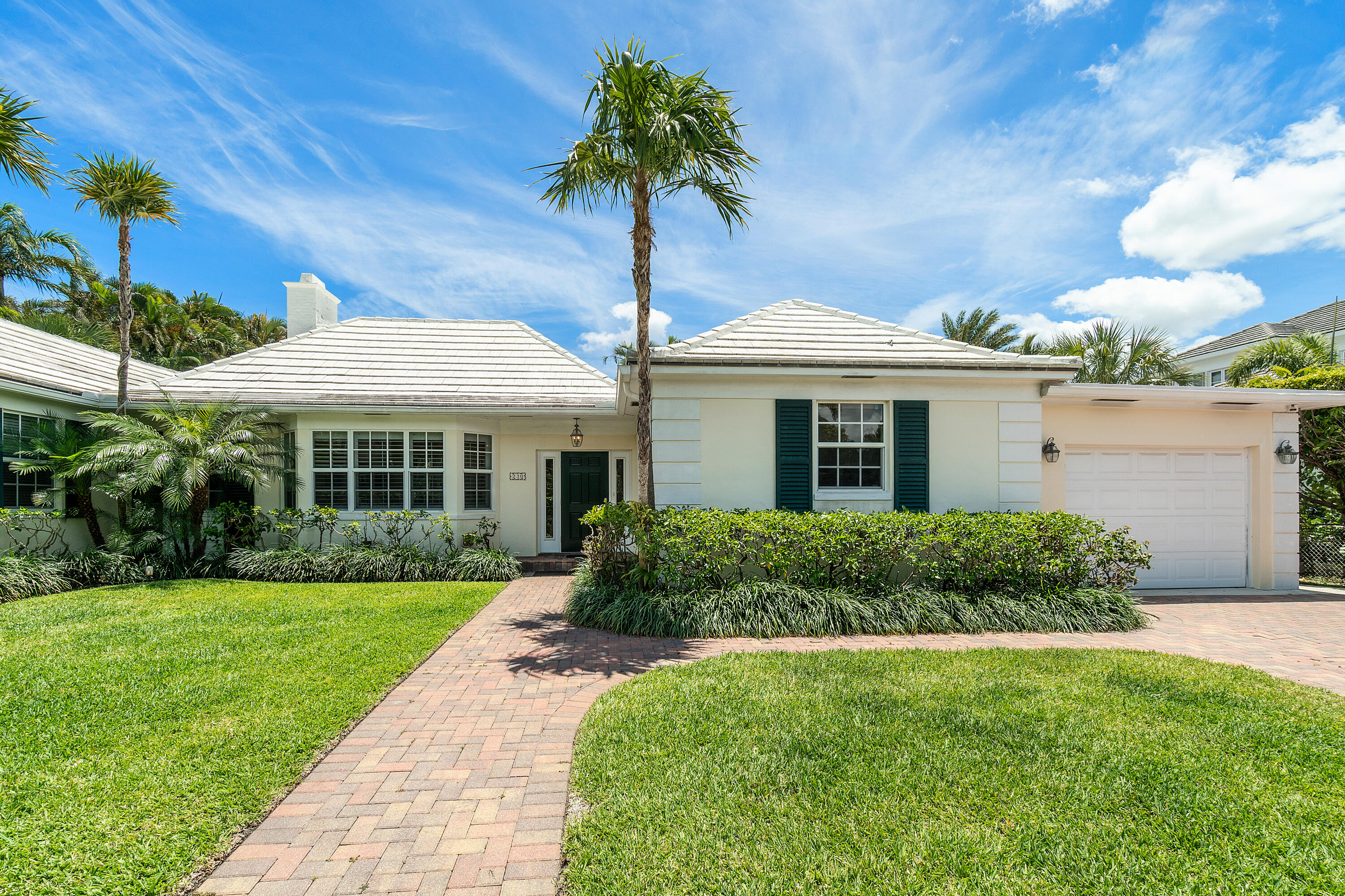 Charming and cheery pool home on quiet north end street.   This quintessential Palm Beach family home offers generous living spaces, comfortable layout and great light.  Spacious living areas include formal living room, dining room, family room.  Four bedrooms plus den/fifth bedroom with built in cabinets.  Great flow for indoor/outdoor entertaining.  Recent updates include new roof and impact glass.