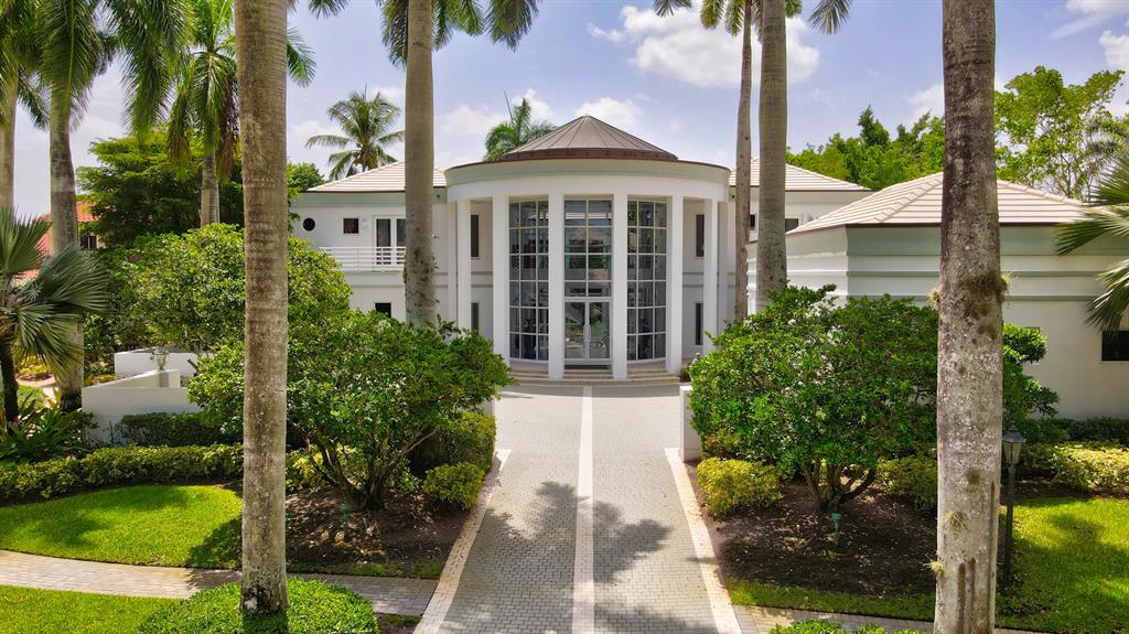 This custom two story contemporary residence, located within the Lake Estates section of St Andrews Country club, is situated on an end cul-de-sac overlooking a beautiful private lake view. A walled motor court leads to a 360 radius grand entry and foyer with views of an open courtyard. Featured is a spacious main first floor bedroom suite and exercise area, office/library, living, family, kitchen, dining and media/theater rooms, with a 3.5 car garage. The entry staircase leads to the second floor which includes four additional en-suite bedrooms all with balcony access. A covered yet open loggia patio opens to the pool area with due south exposure water views. See more... for additional details. Membership to St Andrews CC is increasing to $200,000 as of November 1st 2021. A 'full membership' is the only membership offered and activated at time of closing. 
See listing office for details.  

Additional Amenities-
*Primary/main first floor bedroom has spacious dual closets
*exercise room is accessible via the main bathroom
*library is wood paneled with an extensive filing room
*living room has a full fireplace
*bar services the living room
*open court yard reflecting pool
*spacious kitchen dinette area
*full walk in pantry
*center island kitchen
* ceiling skylights in kitchen
* Outdoor Barbecue in loggia
*Extensive garage storage area
*Second floor open balcony as spiral staircase to lower level
* All secondary bedrooms access outdoor balconies