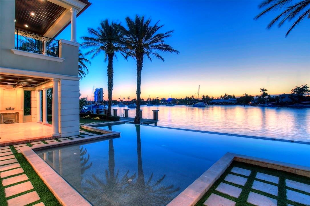 Incredible wide open views over Lake Sylvan (leading to the intracoastal) this ultra-luxurious custom Palm Beach inspired Estate is offered below replacement value & should not be overlooked! With 174+/- ft of straight line deepwater frontage suitable for a large yacht + access to the Surf Club this is a sophisticated choice for boaters & beach-lovers.No expense was spared with quality of build (Bomar) & extensive custom detailing throughout - ceiling heights consistently 12ft. Potential seller financing.